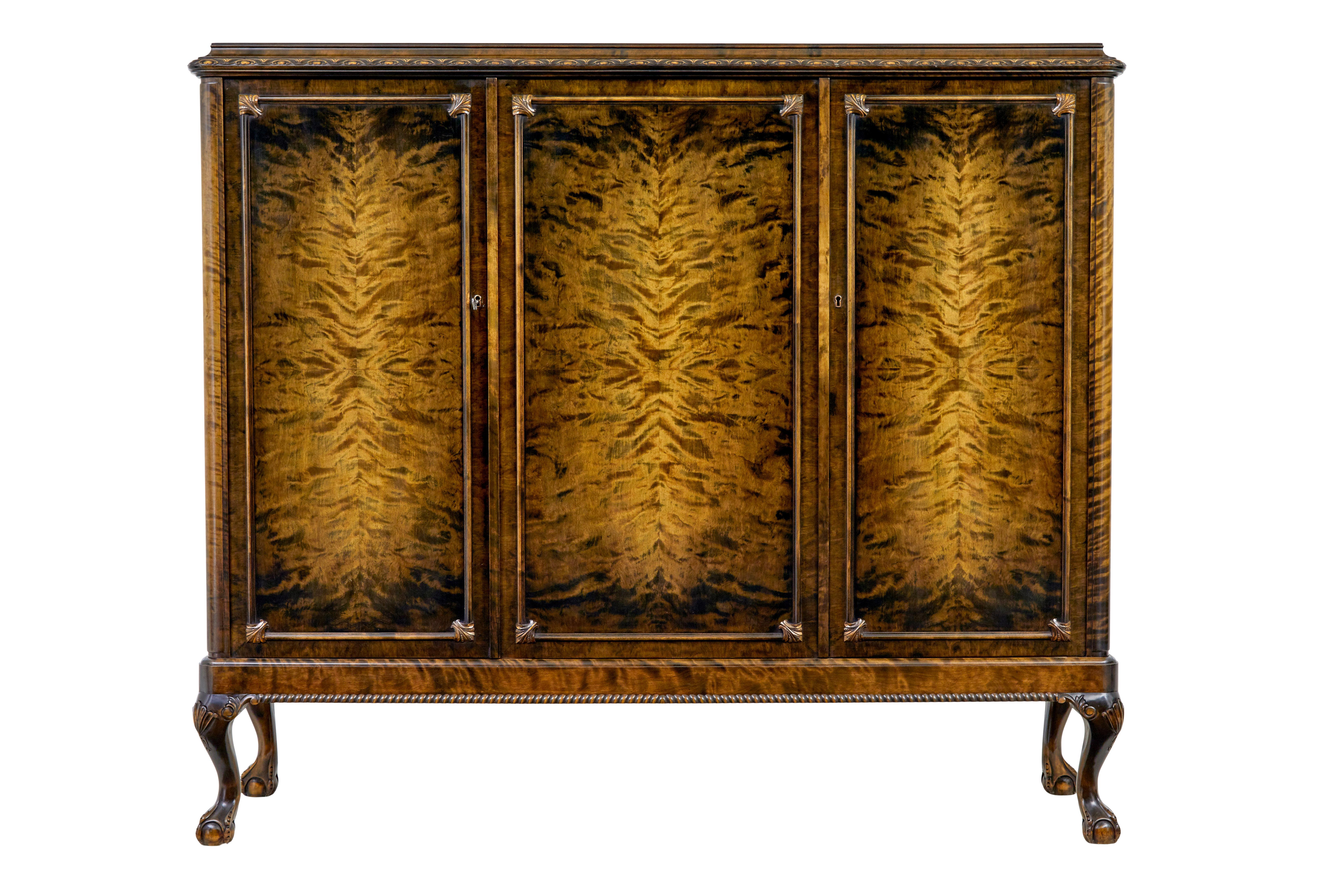Swedish mid century burr birch fitted cupboard circa 1940.

Beautiful swedish cupboard which has just been re-finished in our workshop.

1 piece.  Stepped top with a carved edge below which are 3 doors each decorated in quarter matched veneered burr