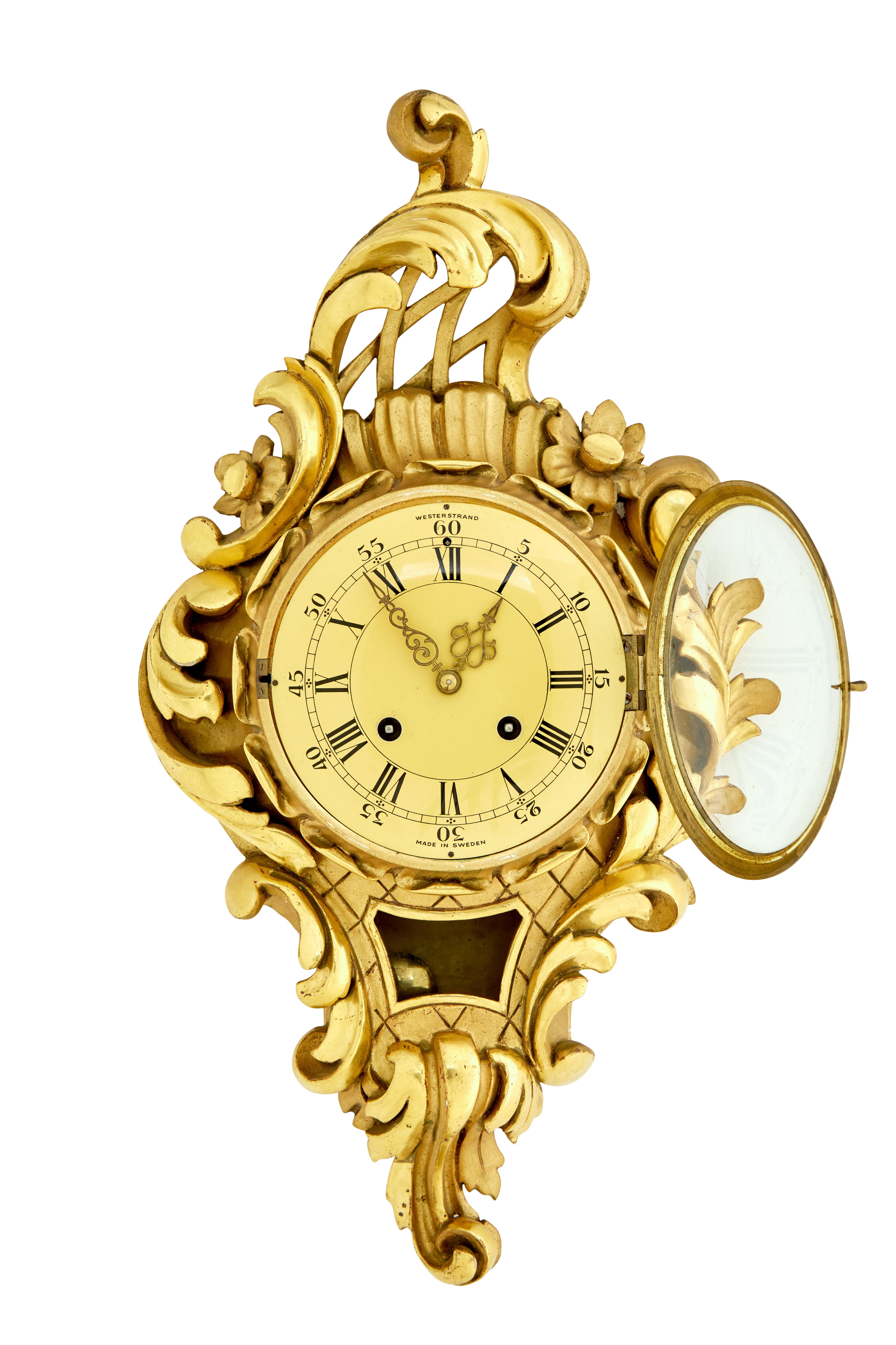 Mid century rococo revival gilt clock by Westerstrand circa 1950.

Good quality rococo influenced clock by well known Swedish maker Westerstrand.

Fitted with a twin train 8 day movement and original pendulum.  Enamel clock face with arabic numerals