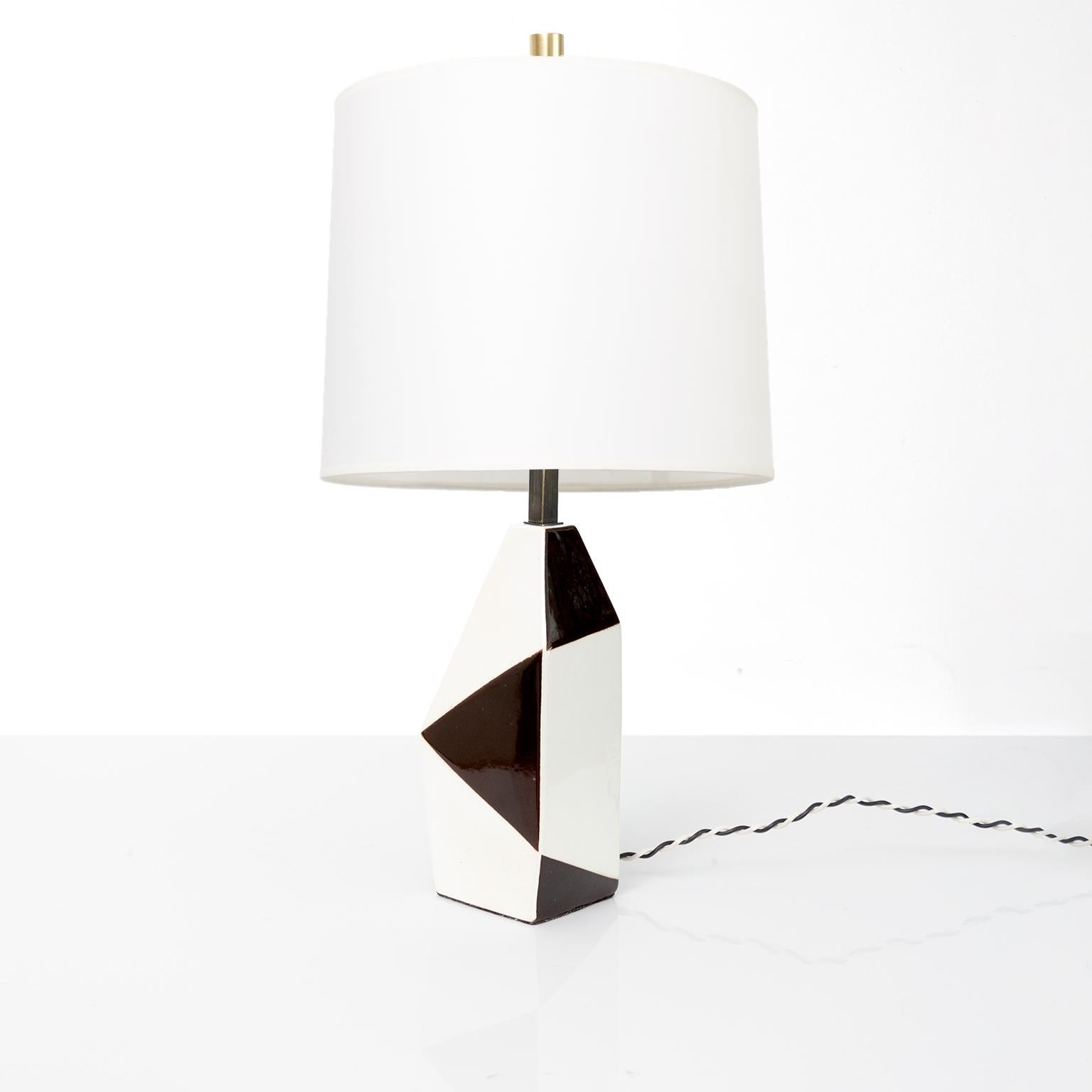 Swedish mid-century ceramic lamp by designer Carl-Harry Stalhane for Rorstrand. The lamp’s body has a variety of geometric shapes alternating in white and dark brown colored glazes. 

Newly re-wired with custom patinated hardware including a 3-way