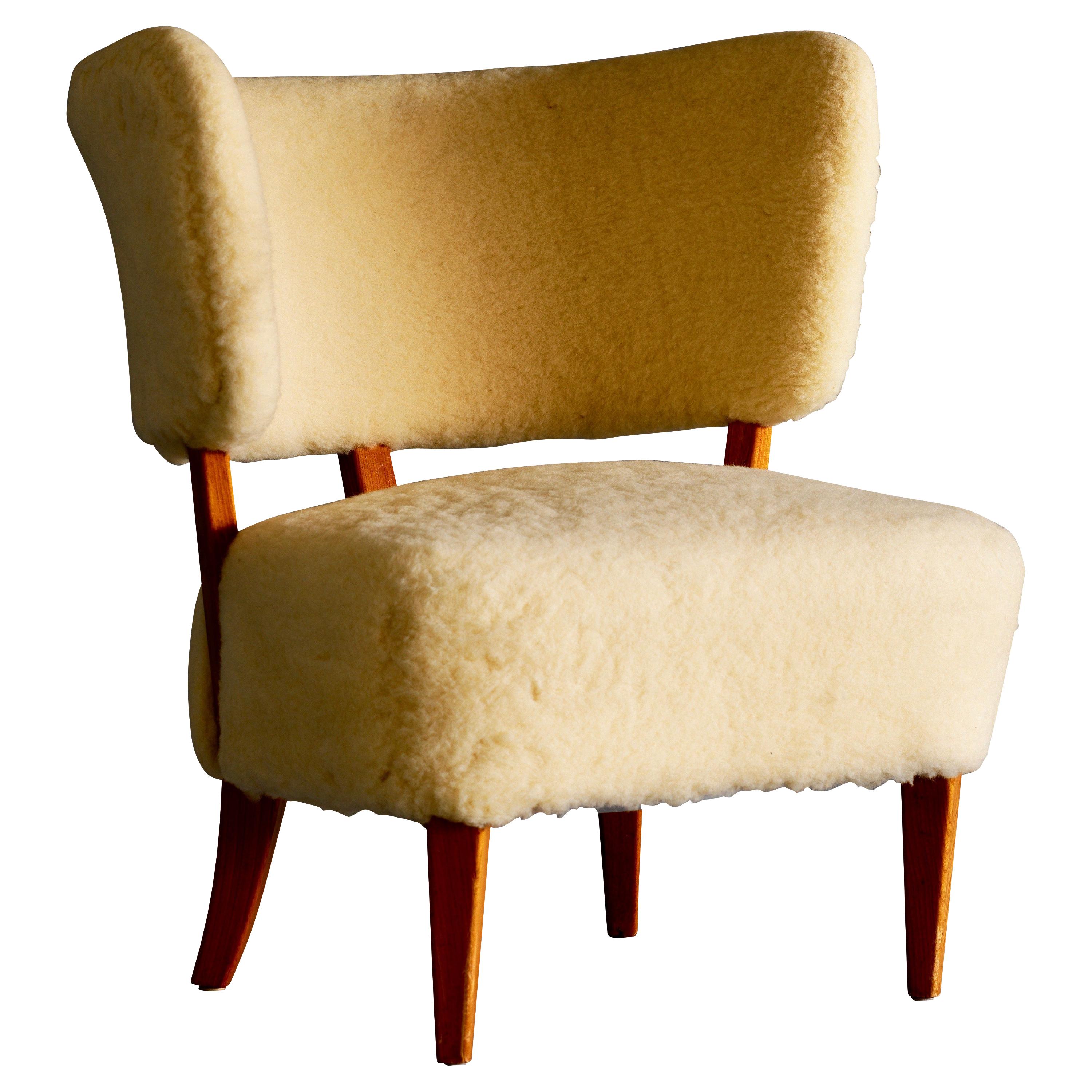 Swedish Mid Century Easy Chair in Sheepskin For Sale