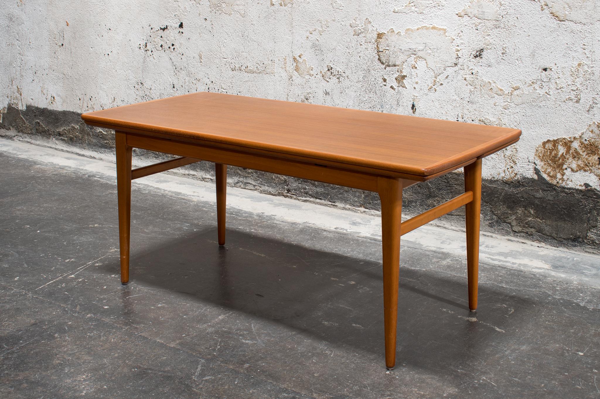 MCM Swedish table in Teak, 1960s. This clever coffee table converts to a game/dining table with an easy-to-use expandable function. Leaves can be pulled out both at coffee table and game table height. This would be a great table for smaller spaces
