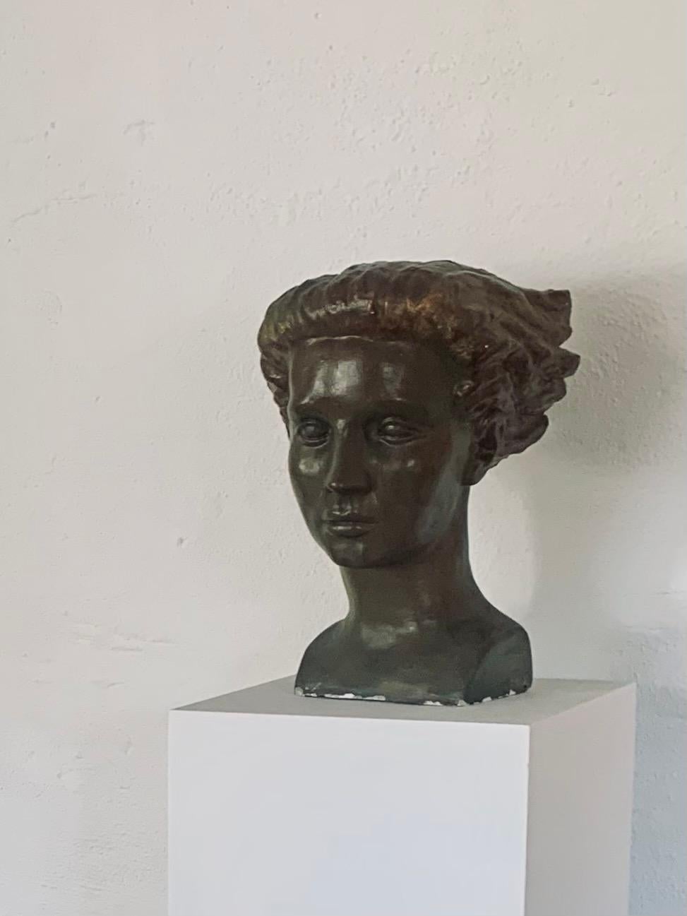 Bronze patinated female plaster bust by the Swedish sculptor Sigge Berggren. Large piece with a strong presence. Some chips and ware adding to the nice patina. 

Sigurd 