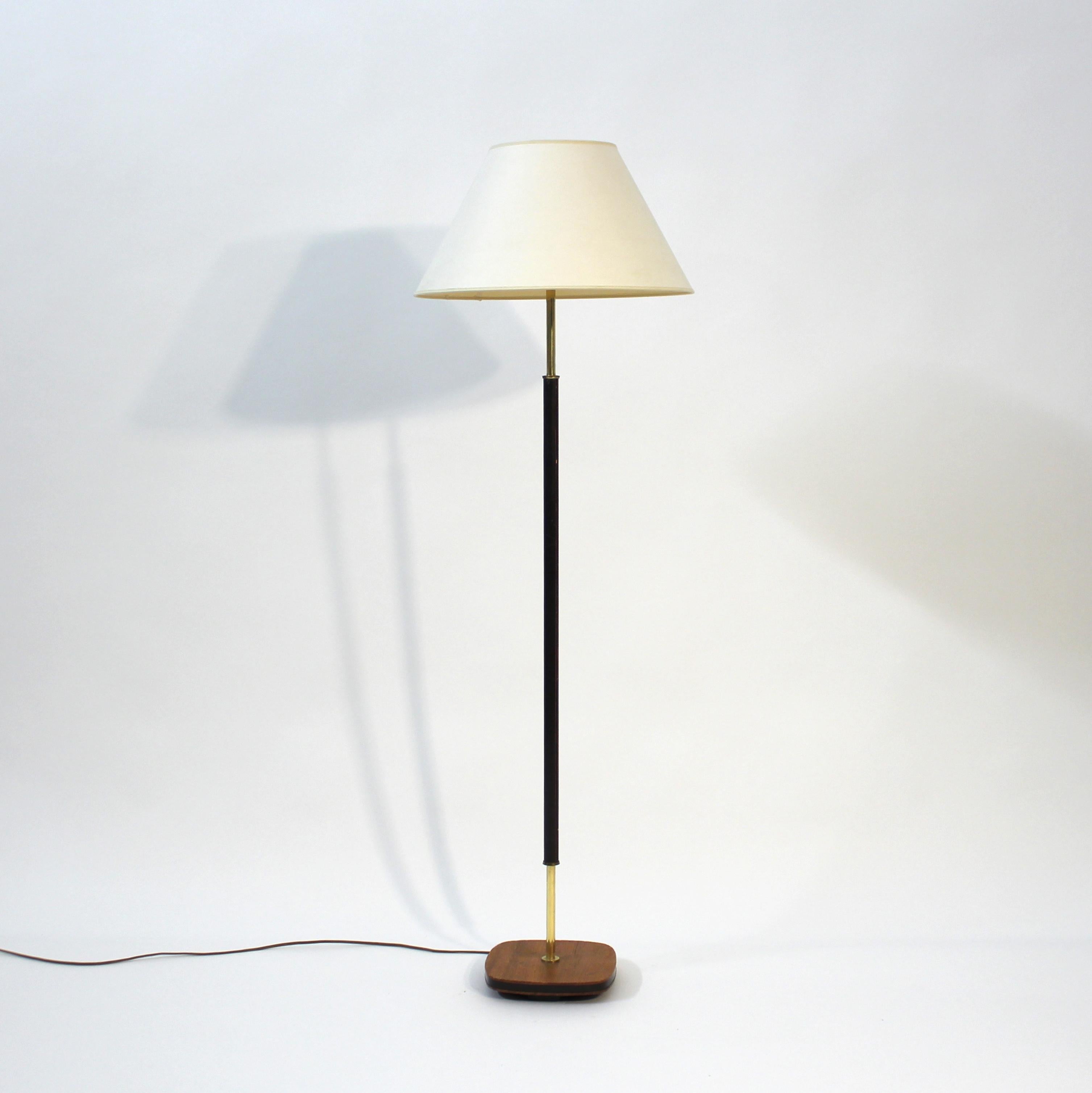 Scandinavian Modern Swedish mid-century floor lamp in teak, brass and leather, 1960s For Sale
