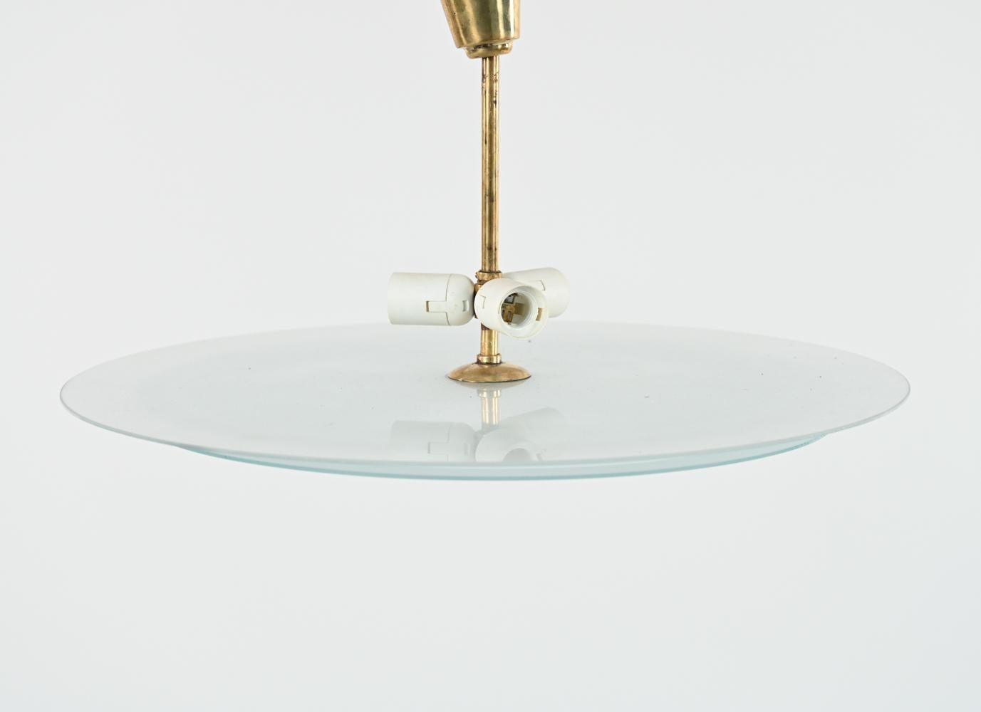 A fabulous Swedish mid-century saucer-form pendant chandelier feature two frosted glass 