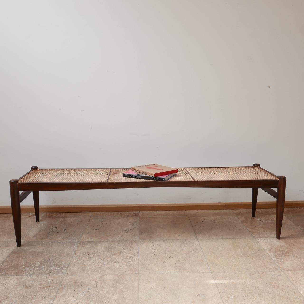A wildly stylish long cane bench which could be used as an elegant coffee table. 

Sweden, circa 1950s. 

Good condition, some scuffs and marks commensurate with age. 

Dimensions: 45 D x 180 W x 45 H in cm.

Delivery: POA.

