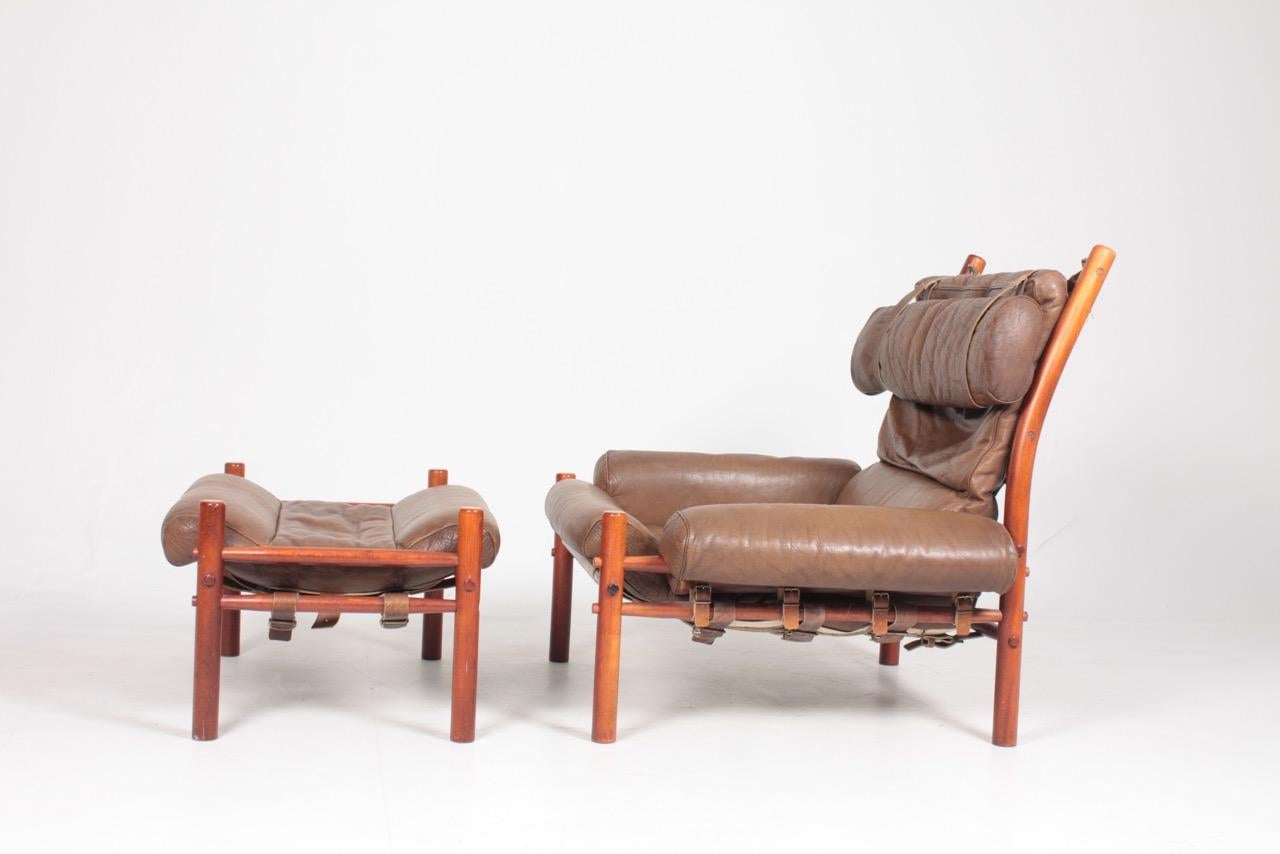 Scandinavian Modern Swedish Midcentury Lounge Chair and Ottoman in Patinated Leather by Arne Norell