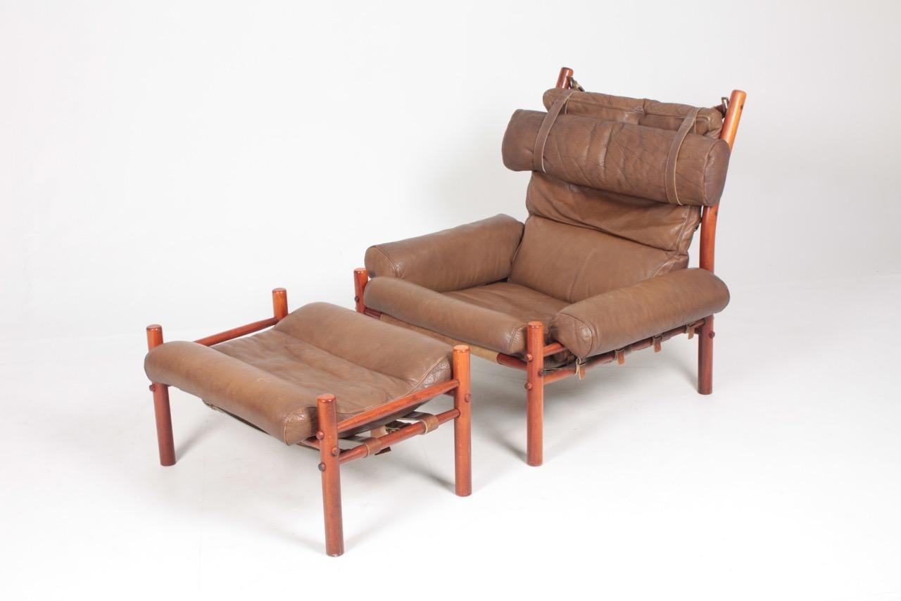 Mid-20th Century Swedish Midcentury Lounge Chair and Ottoman in Patinated Leather by Arne Norell