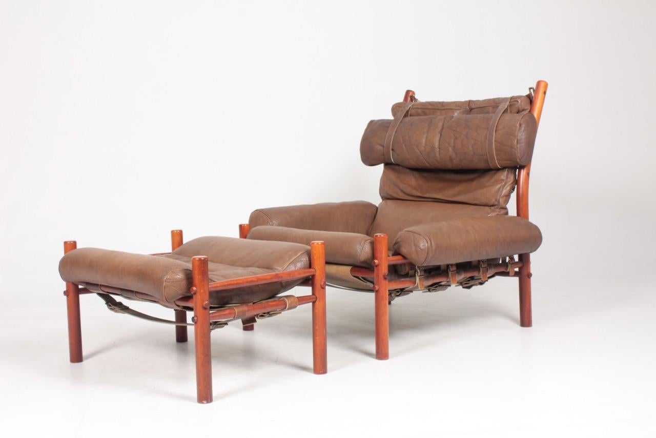 Swedish Midcentury Lounge Chair and Ottoman in Patinated Leather by Arne Norell 1