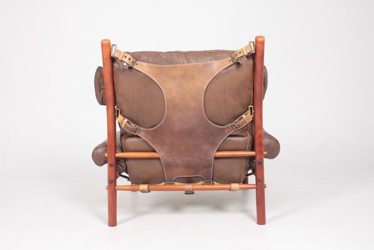 Swedish Midcentury Lounge Chair and Ottoman in Patinated Leather by Arne Norell 2