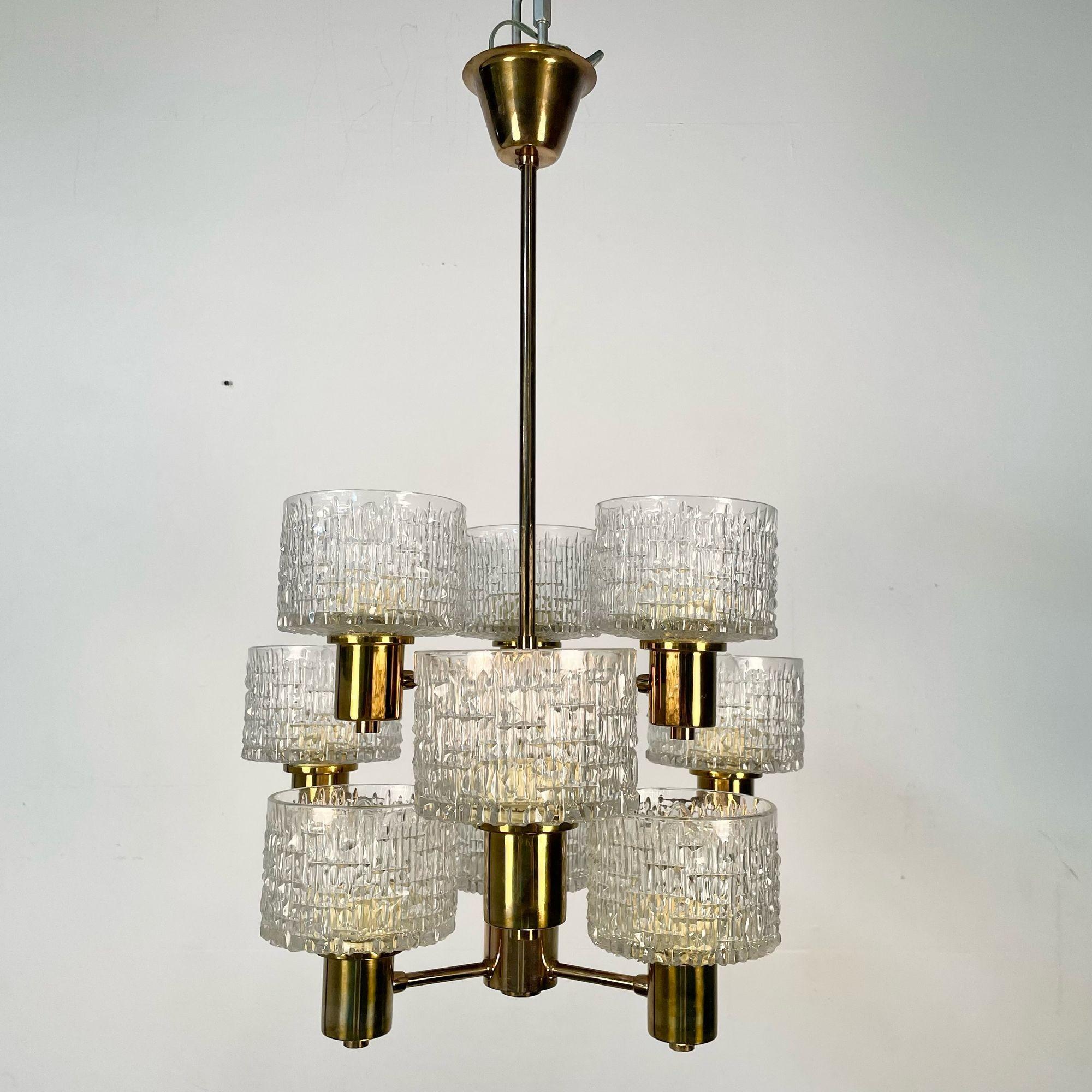Swedish Mid-Century Modern 9 Light Chandelier / Pendant by Hans-Agne Jakobsson
 
Rare chandelier or pendant designed by Hans-Agne Jakobsson in Sweden circa 1960s. Having it's original brass frame with 9 lights and 9 original period correct textured