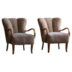 Swedish Mid Century Modern, A Pair of Lounge Chairs in Birch & Lambswool, 1960s