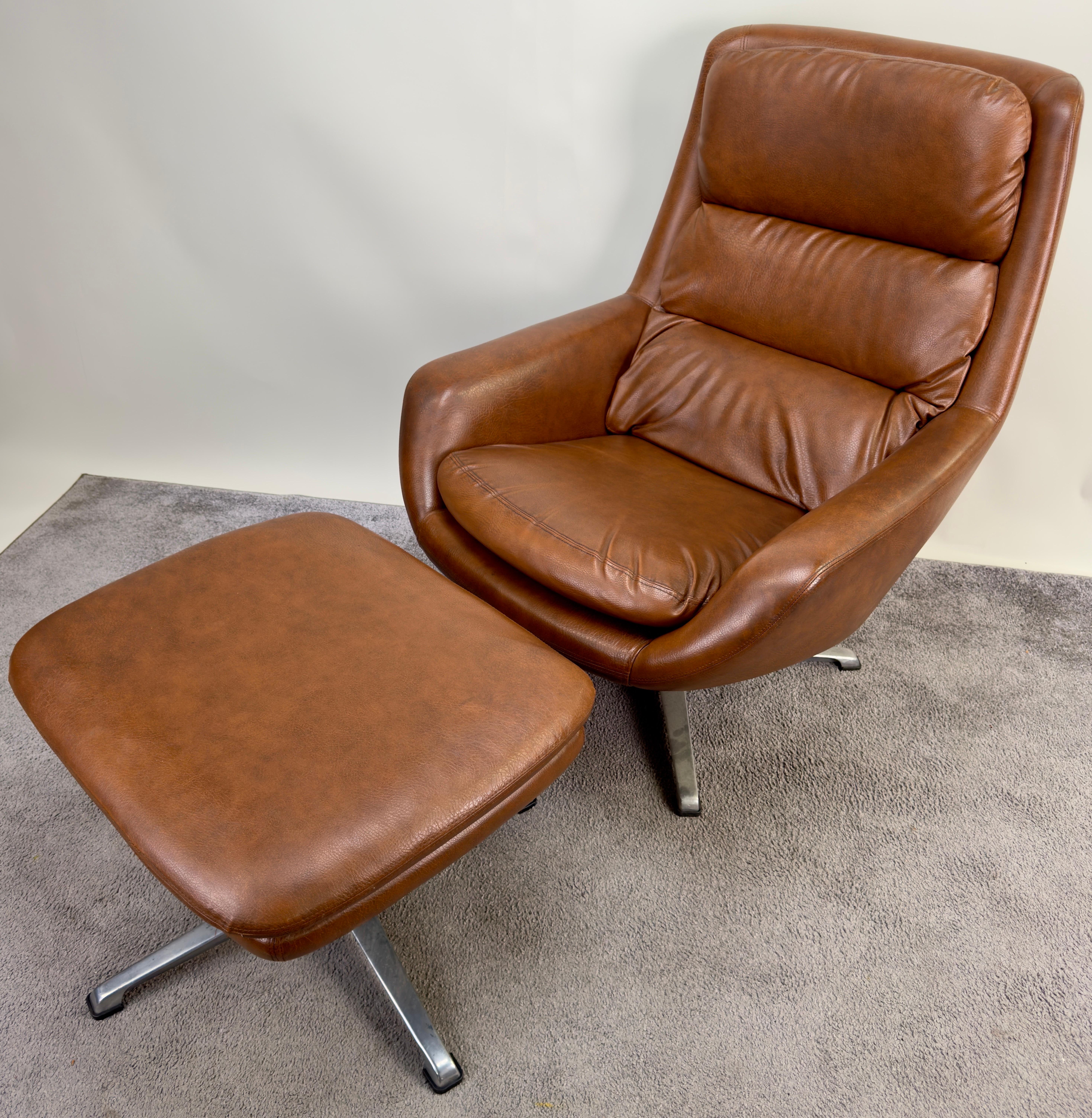a Mid Century Modern lounge chair and ottoman from Sweden. Marrying form and function, this ensemble boasts a swiveling base with tilt and a convenient tilt-locking feature for personalized comfort. Upholstered in luxurious tan brown faux leather,