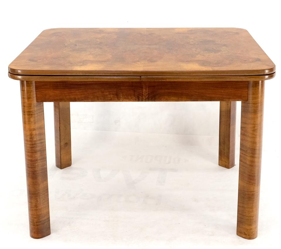 Swedish Mid-Century Modern burl wood refectory extending dining dinette table.
Exceptional burl wood pattern. Table extends to 81''.