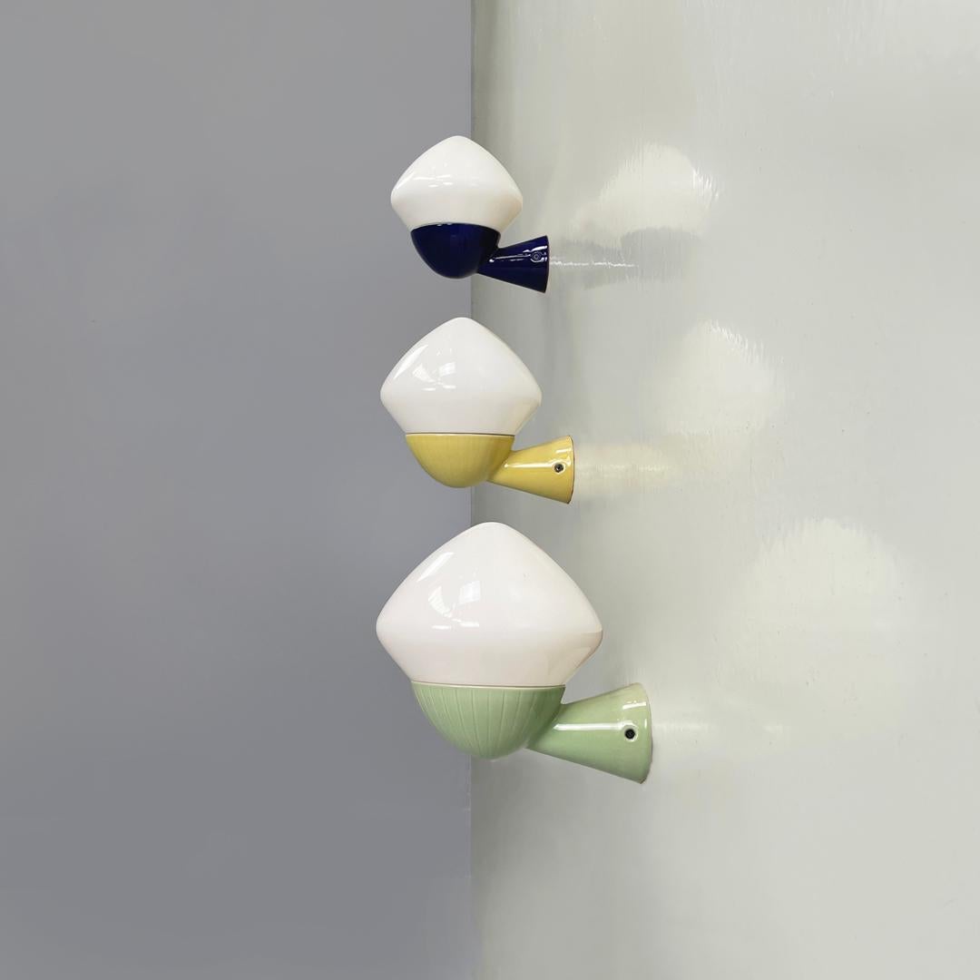 Swedish mid-century modern ceramic appliques 6010 Gunnar Nylund for Ifö, 1960s
Set of three wall lamps mod. 6010 with round base. The structure is in ceramic, the colors are blue, yellow and pastel green, all three have linear decorations. The