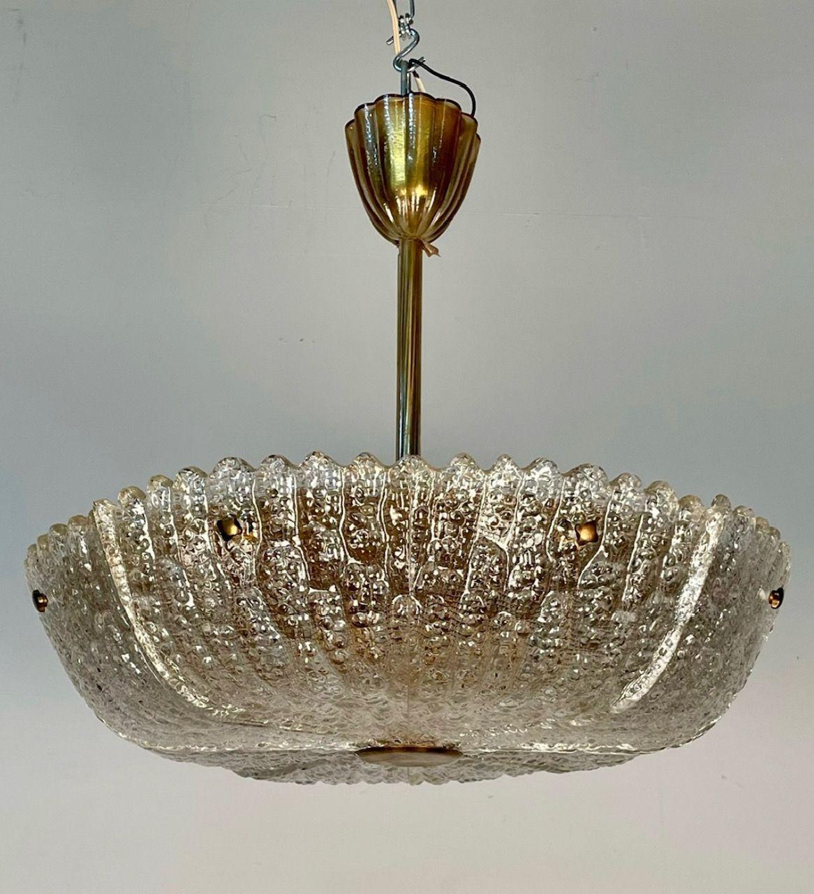 Swedish Mid-Century Modern Chandelier / Pendant by Carl Fagerlund for Orrefors
 
Textured Glass, Brass
Sweden, c. 1960s
 
24 dia x 23 drop