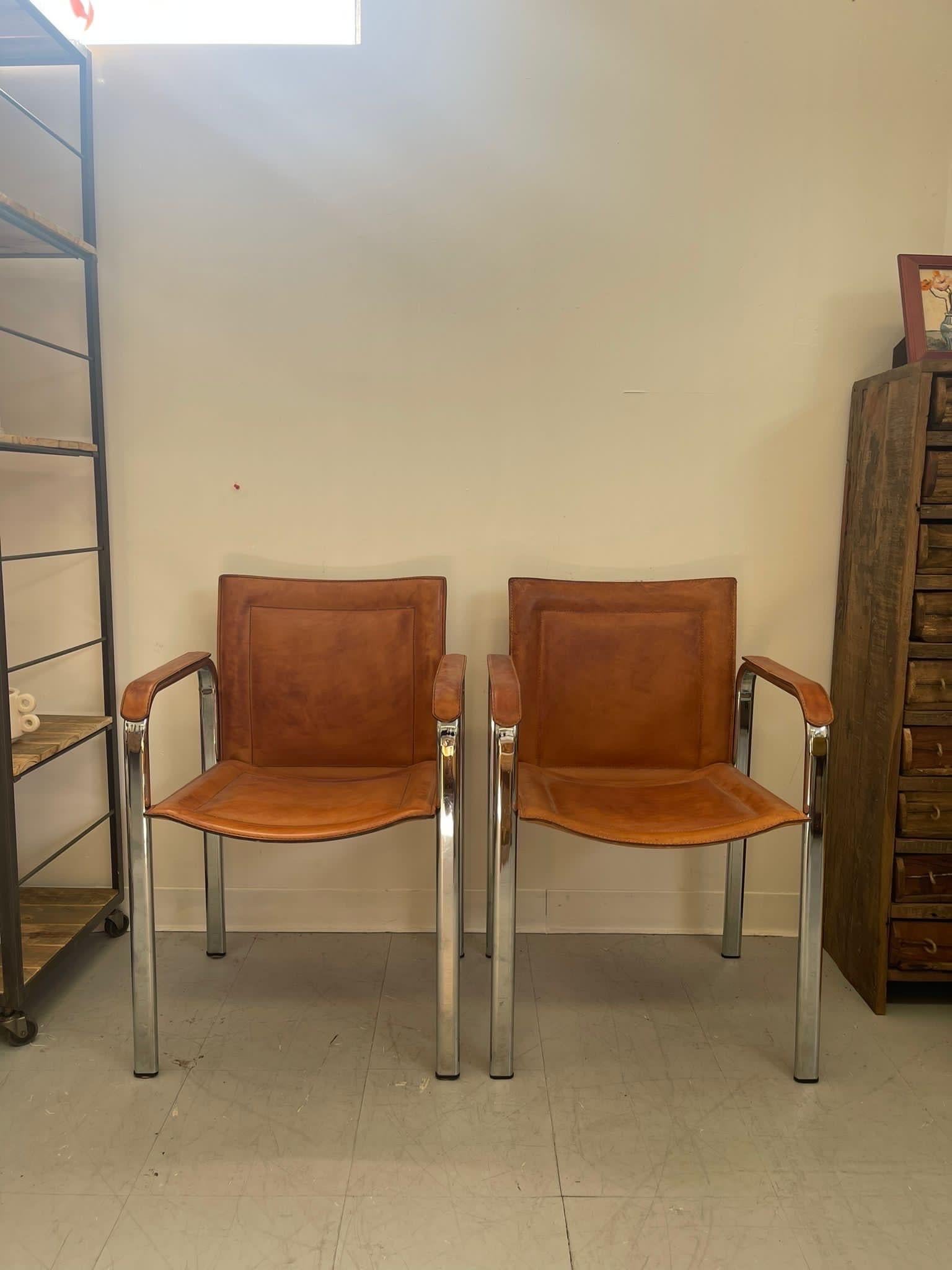 Swedish Set of Chairs with Leather Seats and Arm Rests. Silver Chrome Accent. Vintage Condition Consistent with Age as Pictured.

Dimensions. 22 W ; 19 D ; 32 H