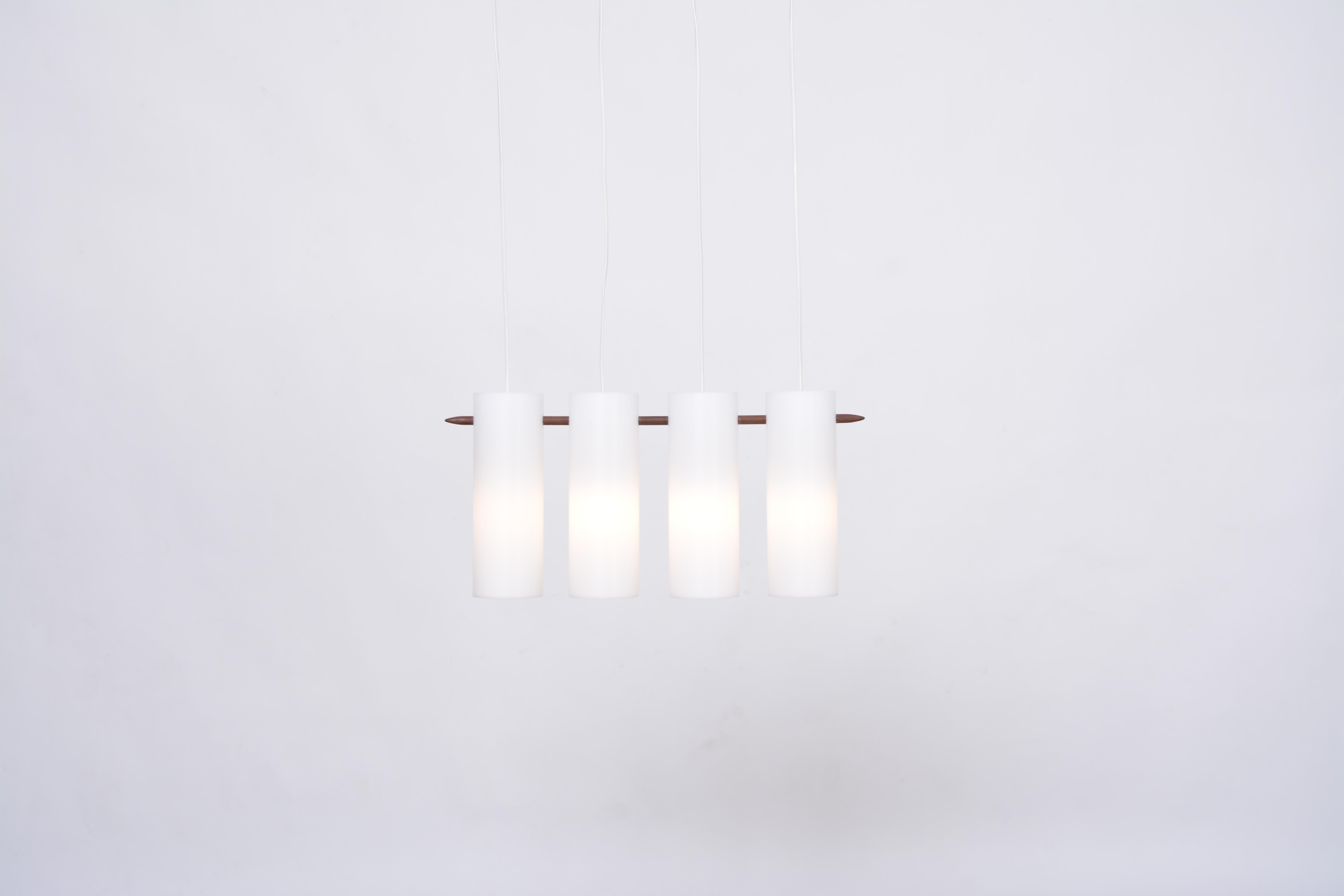 Swedish Mid-Century Modern pendant lamp by Uno and Östen Kristiansson for Luxus.
This minimal Mid-Century Modern pendant lamp or hanging light was designed by Swedish brothers Uno & Östen Kristiansson and produced by their company Luxus in Vittsjö,
