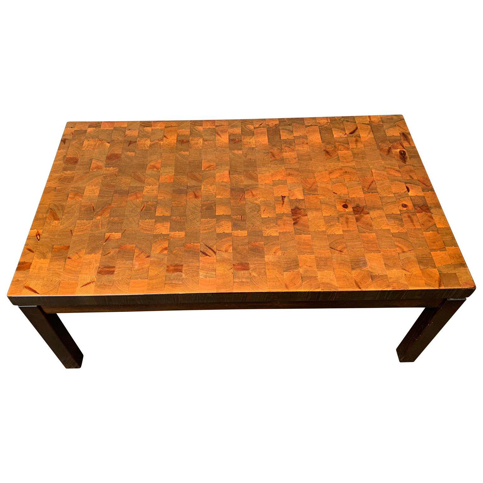 A Swedish designed vintage sofa table from circa 1970 in dark pine and lighter pattern of cubes of pine. 
This Scandinavian piece is Marked 