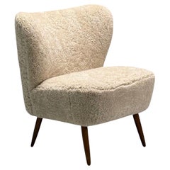 Moderna sueca de mediados de siglo, Silla Slipper de piel de oveja beige, Haya