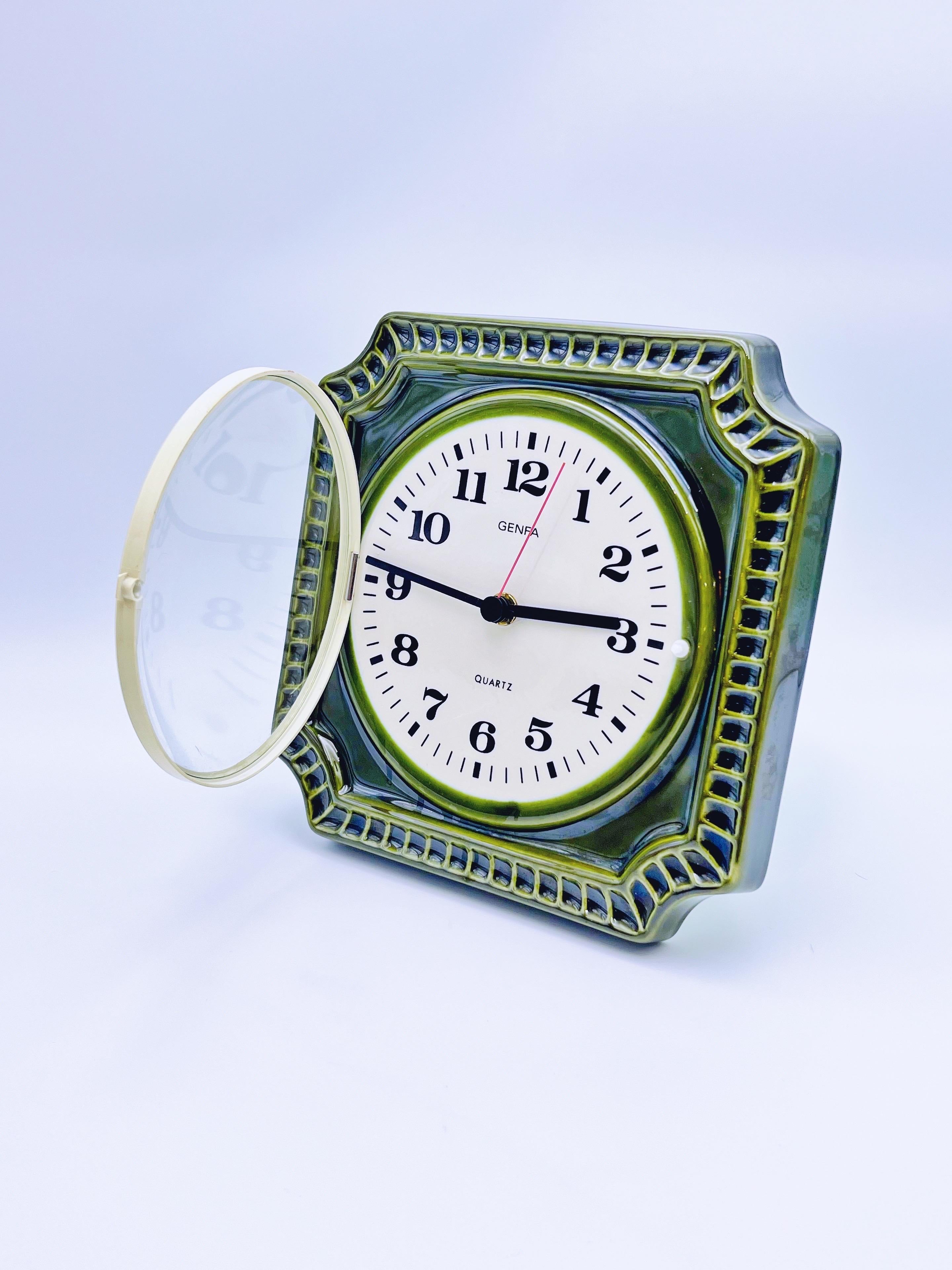 Bring timeless Scandinavian design into your home with this stunning mid-century modern wall clock from renowned Swedish design Carl Westh. The clock features a bold green patterned ceramic frame that adds a vibrant, artistic touch to any space. Its