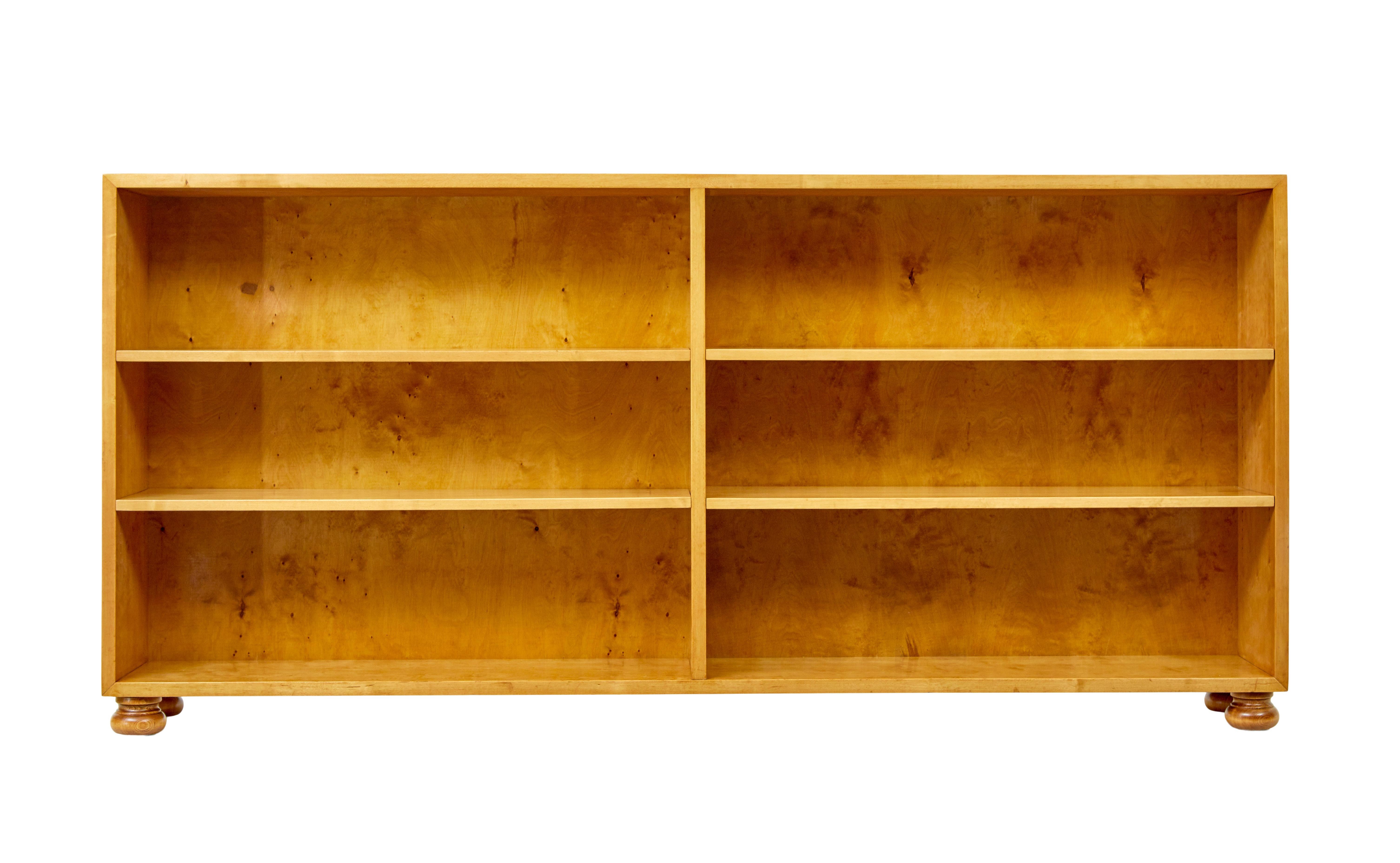 Swedish mid century open birch bookcase circa 1950.

Simple and elegant design that will easily suit most interiors in the home.

Rectangular shaped, made in birch.  Central partition forms the support for 2 adjustable shelves each side, allowing 6