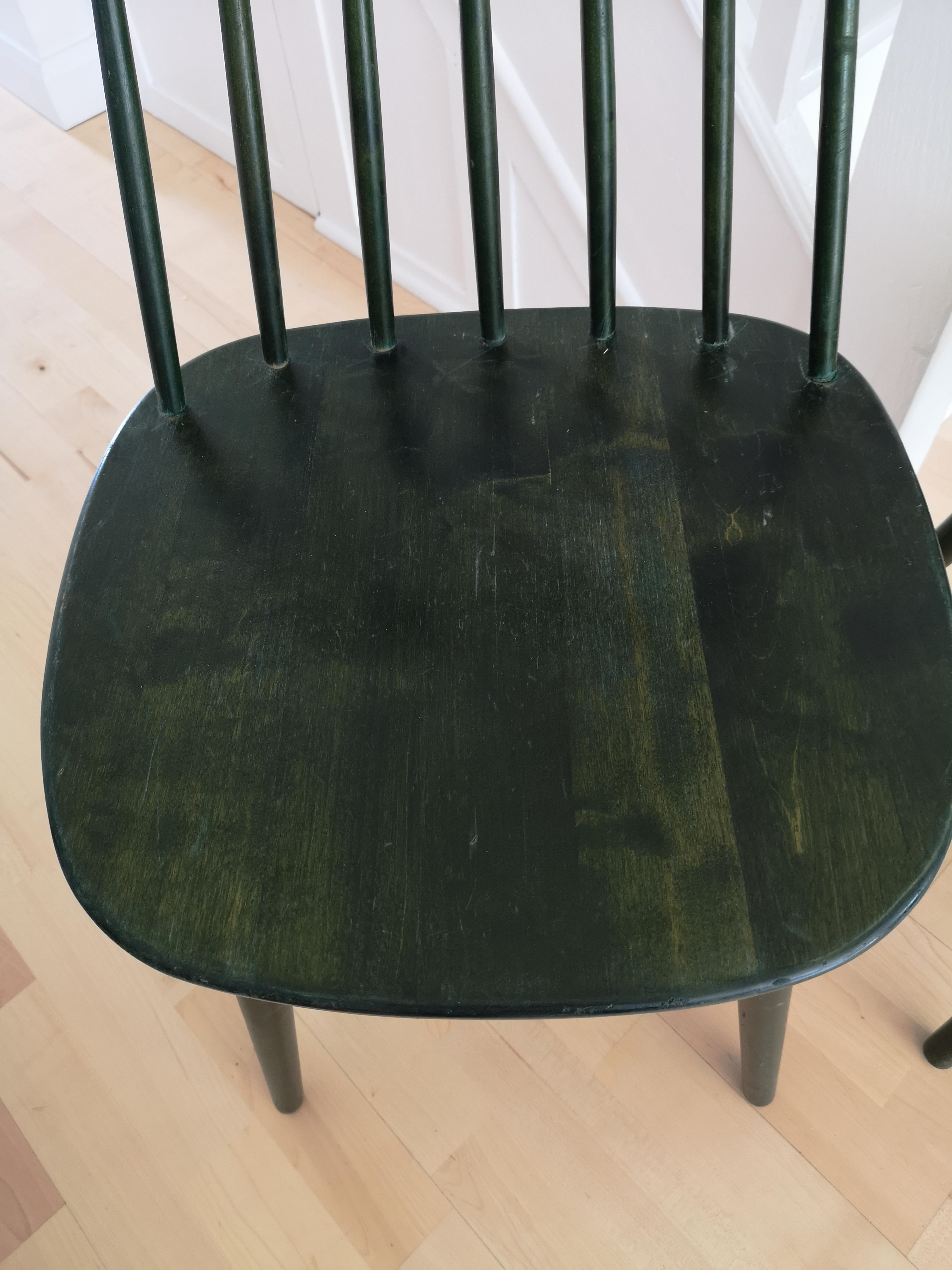 A fabulous set of 4 Swedish midcentury Pinnockio spindle back birch dining chairs designed by Yngve Ekström for Stolab in the 1950s. The chairs have original dark green staining. Lovely grain and finger joint detailing. All chairs have been