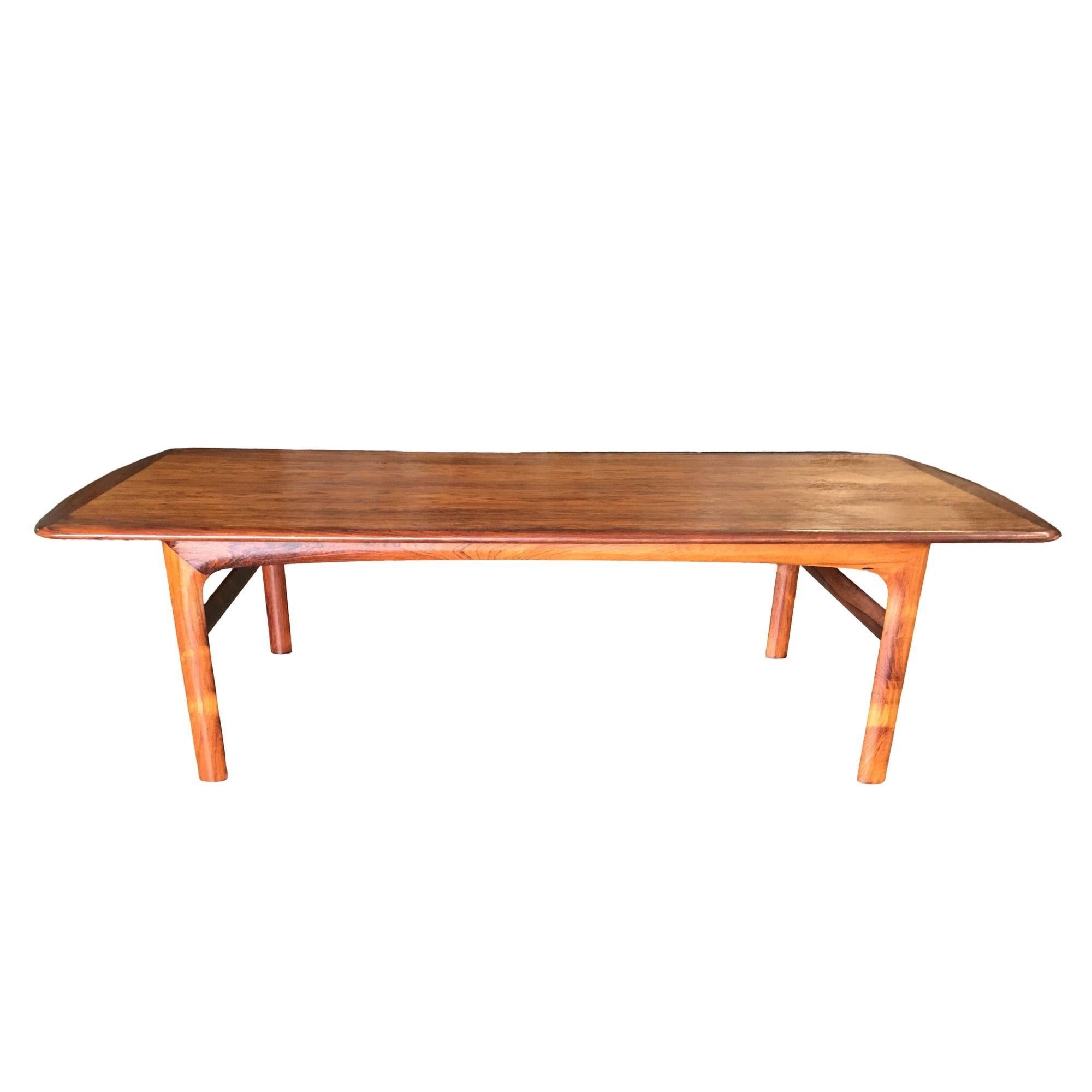 Swedish Mid Century modernist coffee table made from rosewood with inlay two-tone top by Folke Ohlsson.

This item includes restricted materials and can not be sold outside of the contiguous United States.