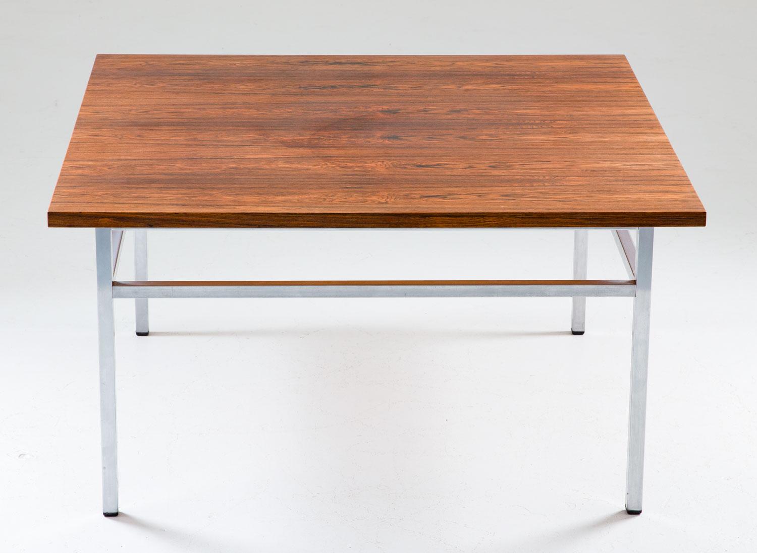Beautiful rosewood and steel coffee table by Karl-Erik Ekselius for Troeds, Sweden
The table consists of a square rosewood tabletop, supported by a brushed steel frame/legs. 
Condition: Good original condition, light signs of use and age and one