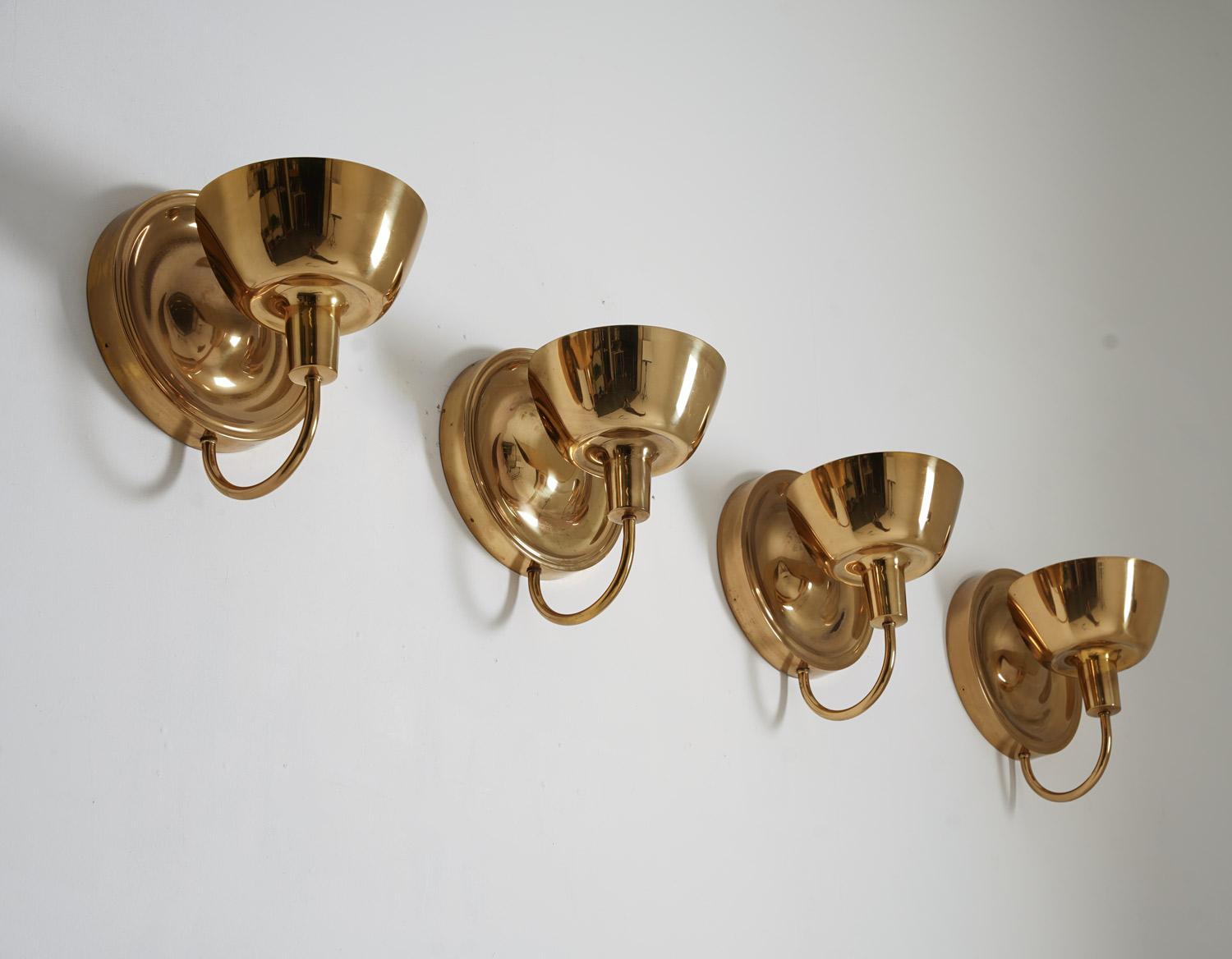 Stunning wall sconces model 2389 by Josef Frank for Svenskt Tenn. The lamps give a soft secondary light as the reflectors lighten up the brass back plate.

Condition: Very good original condition with a soft patina. Some imperfections such as light