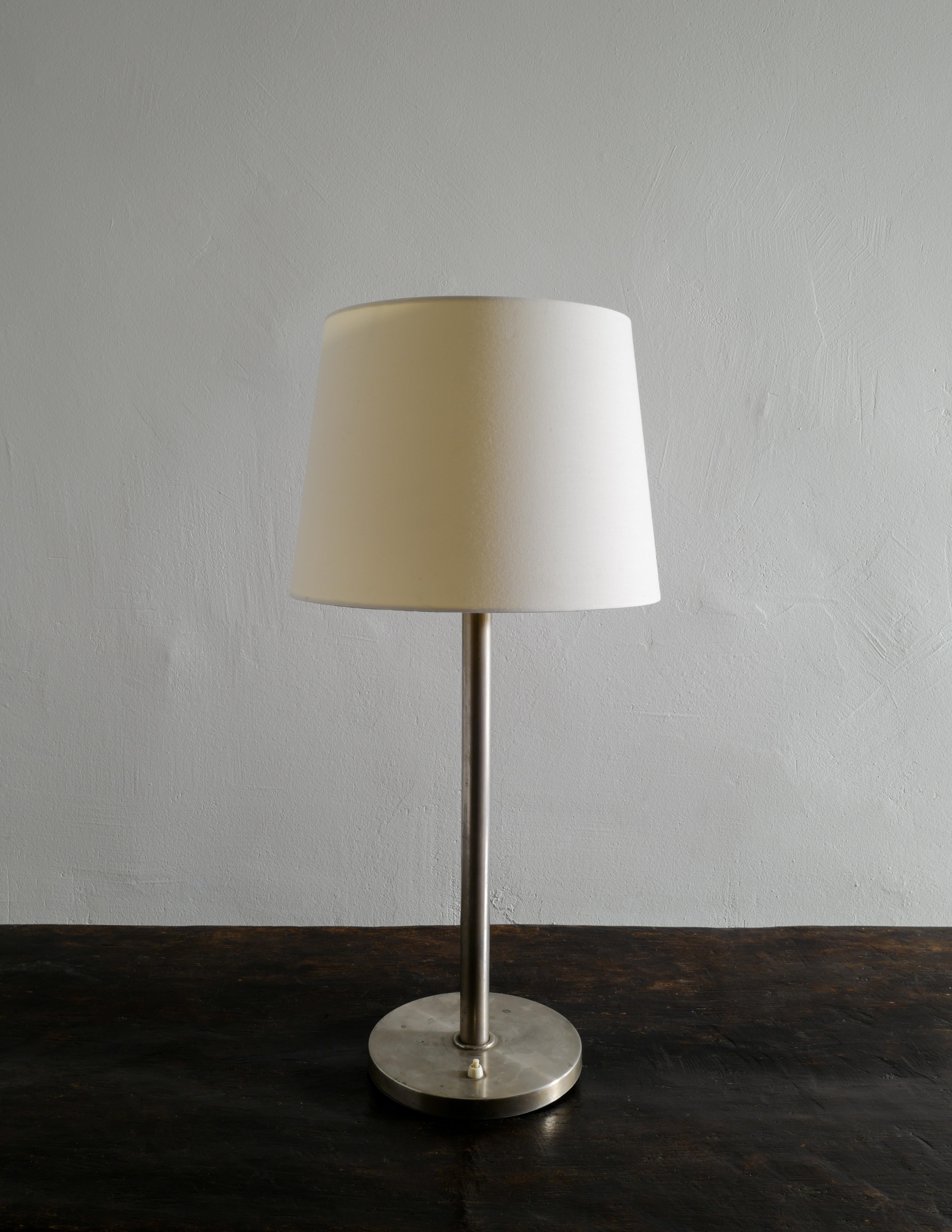 Rare mid century table lamp in brass produced by Böhlmarks, Sweden during the 1960s. In good vintage condition with beautiful patina from age and use. 
Shade is not included in the purchase. 

Dimensions: H: 54 cm (without the shade) Diameter of