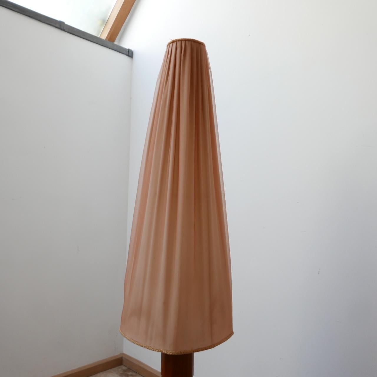 A teak mid-century floor lamp. 

Sweden, c1960s. 

Original shade retained but might want to be updated with a more contemporary linen affair. The shade is in generally good condition but has evidence of age. 

Re-wired and PAT tested.