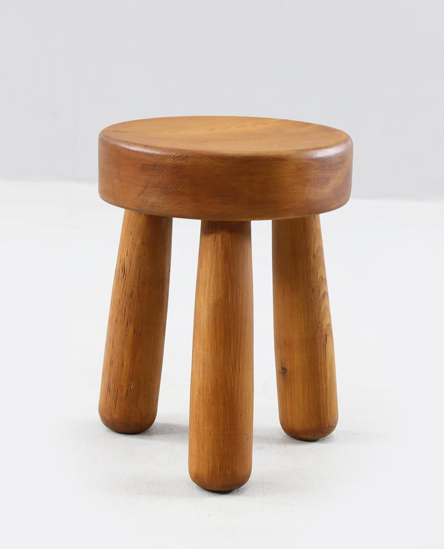 Rare tripod stool in stained pine. Produced in Sweden by an unknown designer. Stamped 