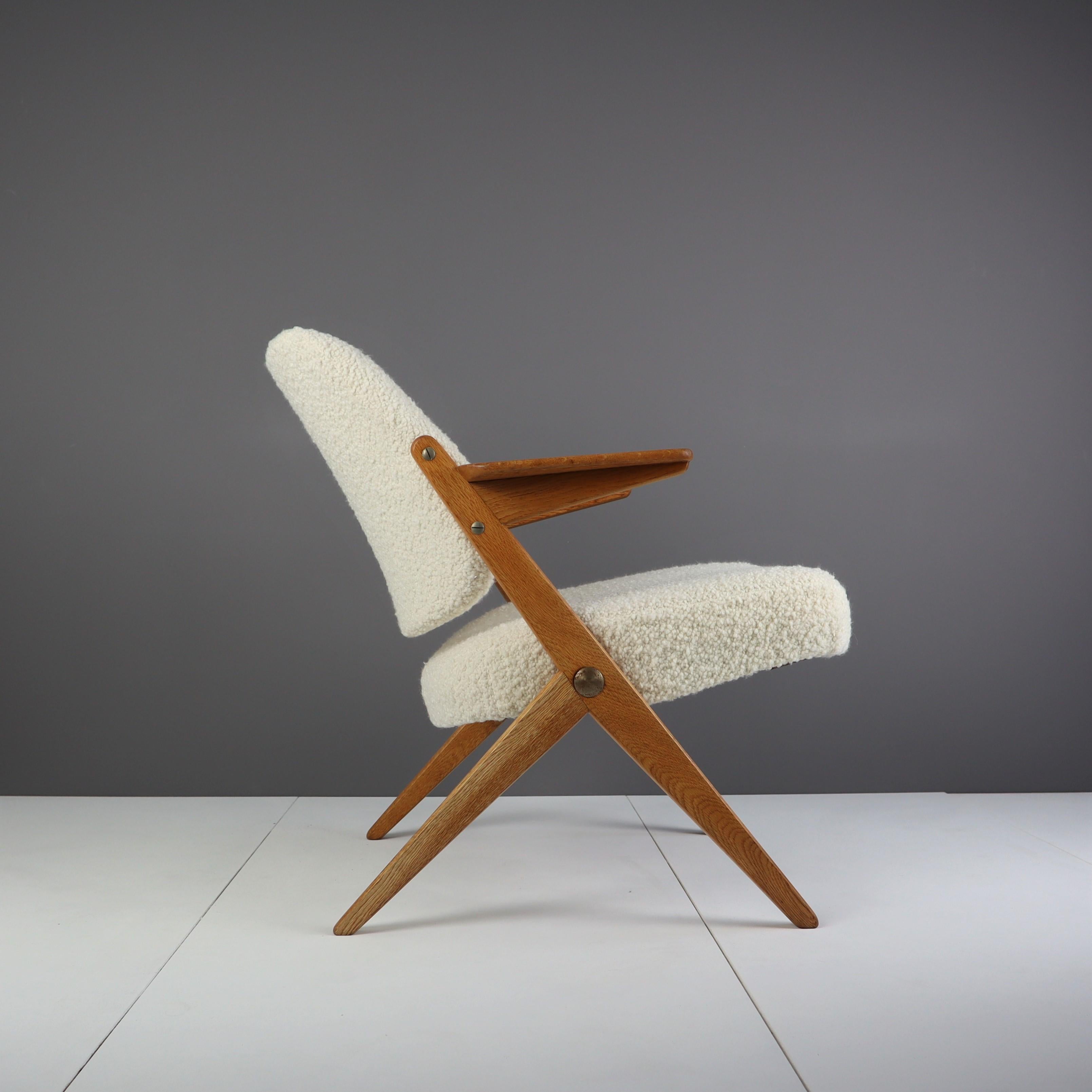 A rare Bengt Ruda midcentury oak armchair reupholstered with an Italian off-white bouclé fabric from Designers Guild’s Lana collection.

We bought this chair at an auction in Malmö, Sweden in March 2022. We have a penchant for midcentury Swedish