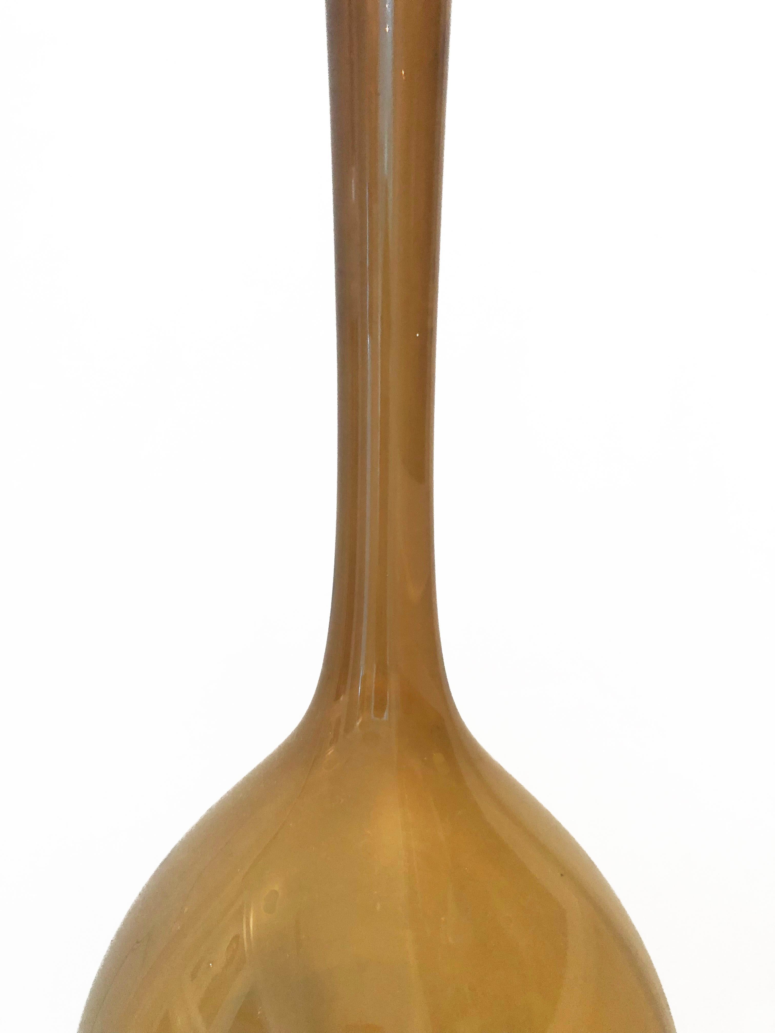Swedish Mid-Century Modern Gorgeous amber bulbous thin glass-bottle vase made by Arthur Percy for Aseda Gullaskruf of Sweden. 
The body is of teardrop form with an elongated slightly flaring neck.
     