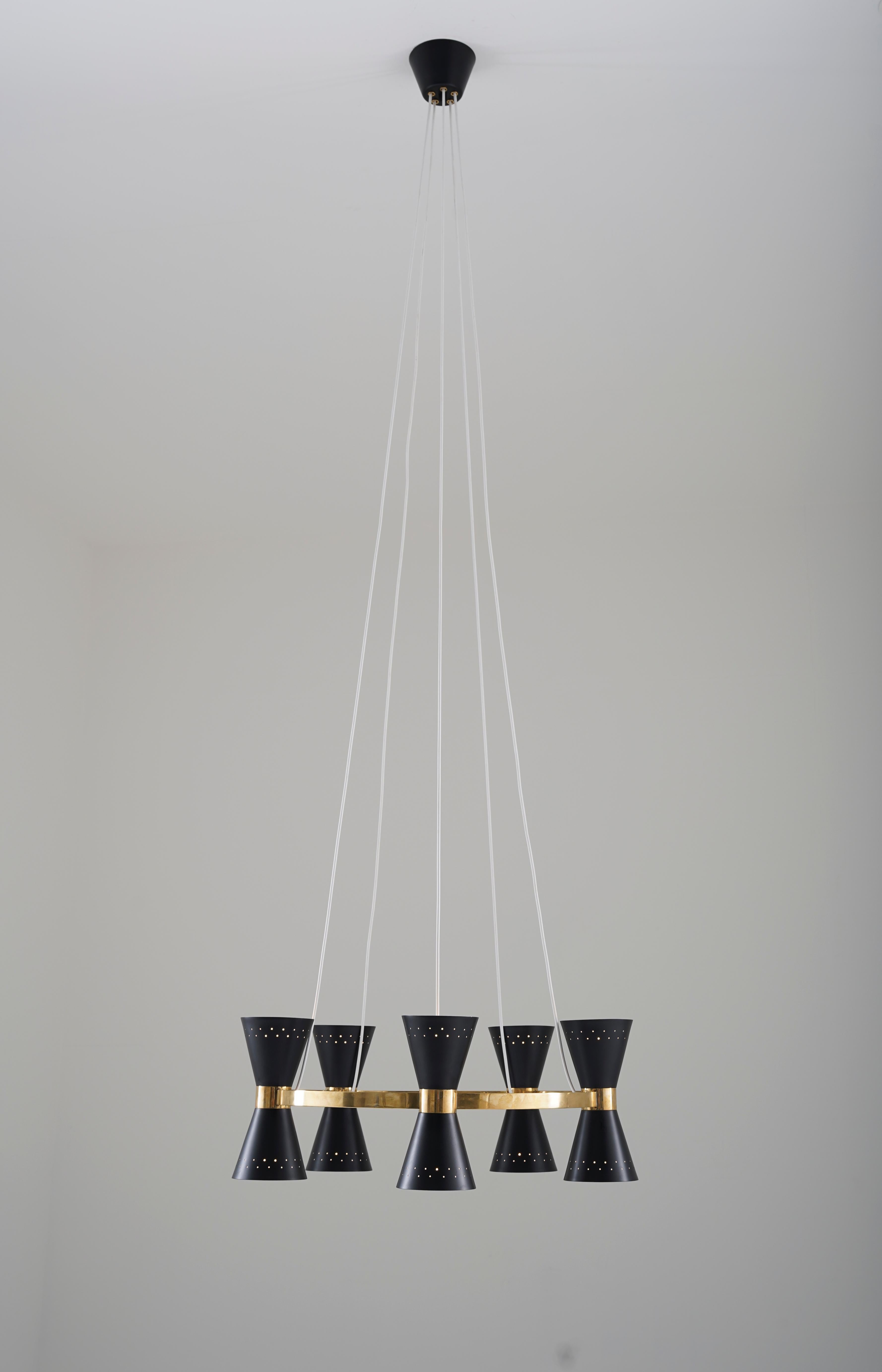 Rare chandelier by Alf Svensson for Bergboms, Sweden, 1950s.
This beautiful chandelier consists of a solid brass ring, supporting 10 cone-shaped perforated metal shades, each of them hiding a light source.

Condition: Very good restored