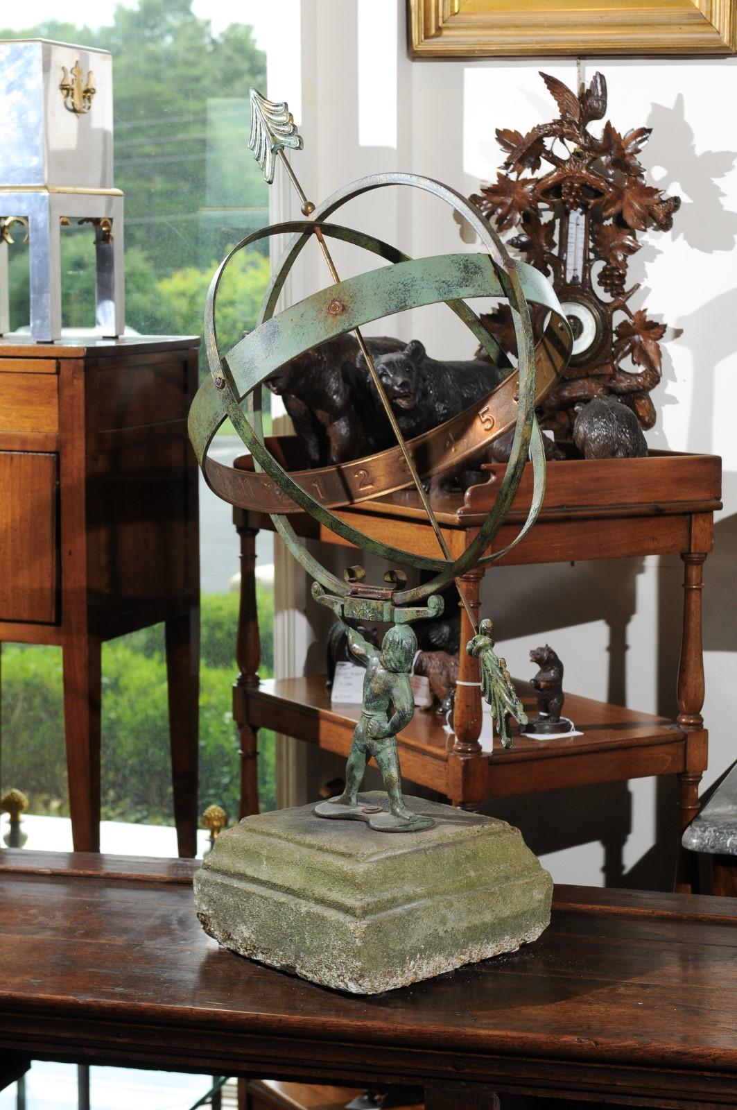 A Swedish vintage copper armillary from the mid-20th century, depicting Atlas carrying the world. Born in Sweden during the midcentury period, this exquisite armillary depicts the famed Titan Atlas, condemned to carry the sky on his shoulders for
