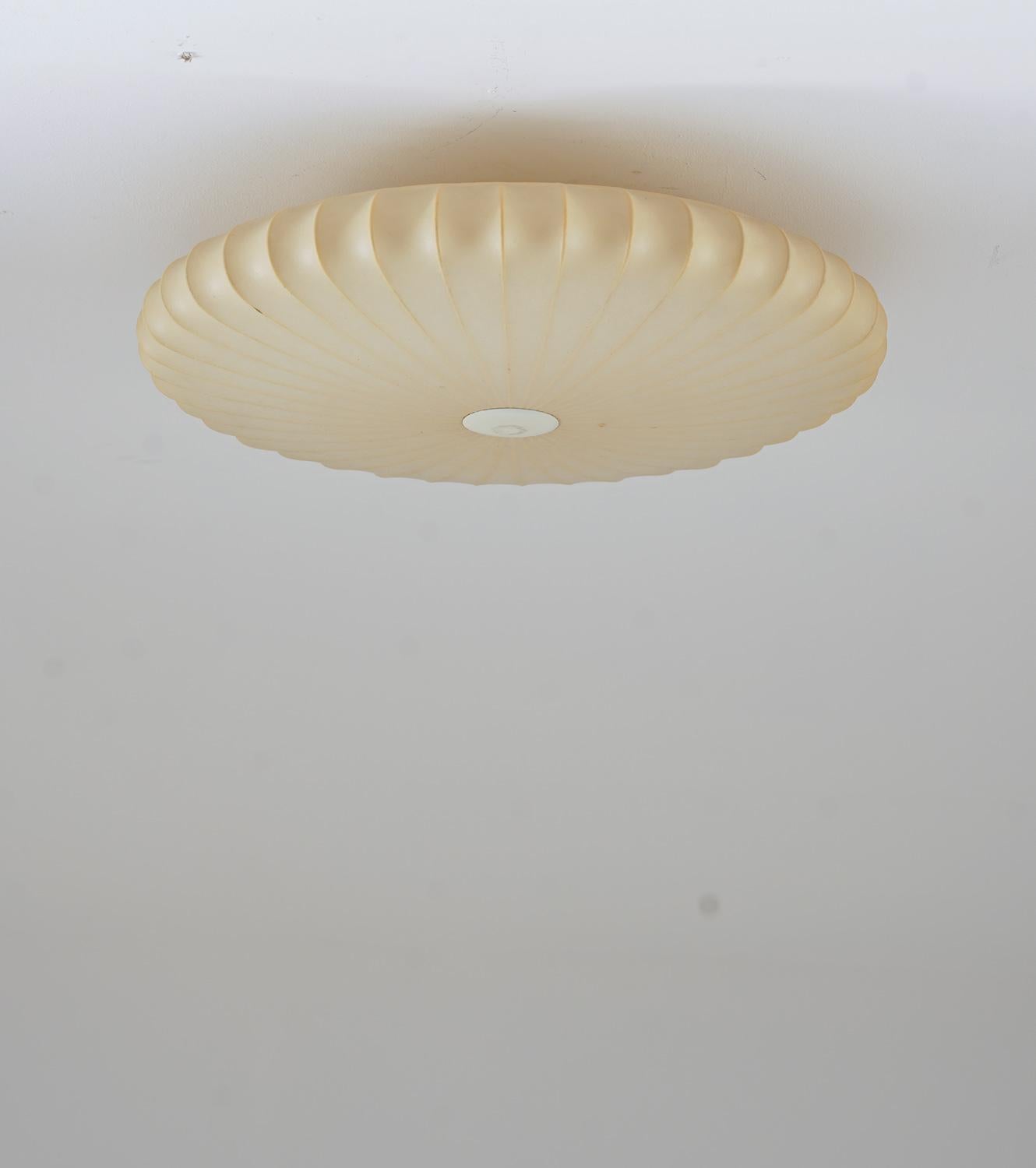 Rare flush mount by attributed to Hans Bergström for Ateljé Lyktan, Åhus.
The lamp consists of a brass body with three light sources, holding a spray plastic shade, that gives a stunning soft light when lit up.

Condition: very good original