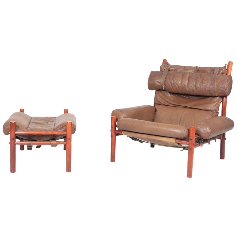 Swedish Midcentury Lounge Chair and Ottoman in Patinated Leather by Arne Norell