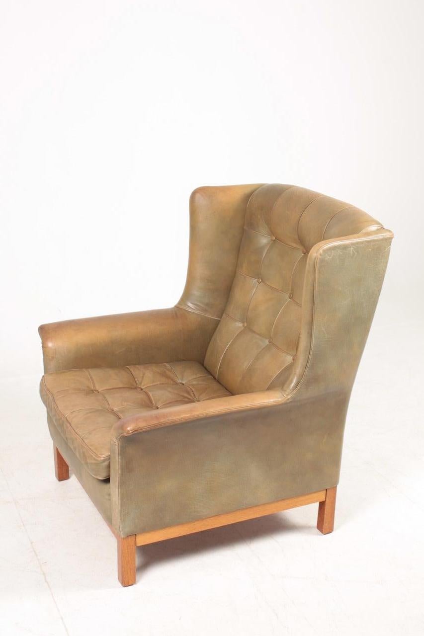 Mid-20th Century Swedish Midcentury Lounge Chair in Patinated Leather by Arne Norell For Sale