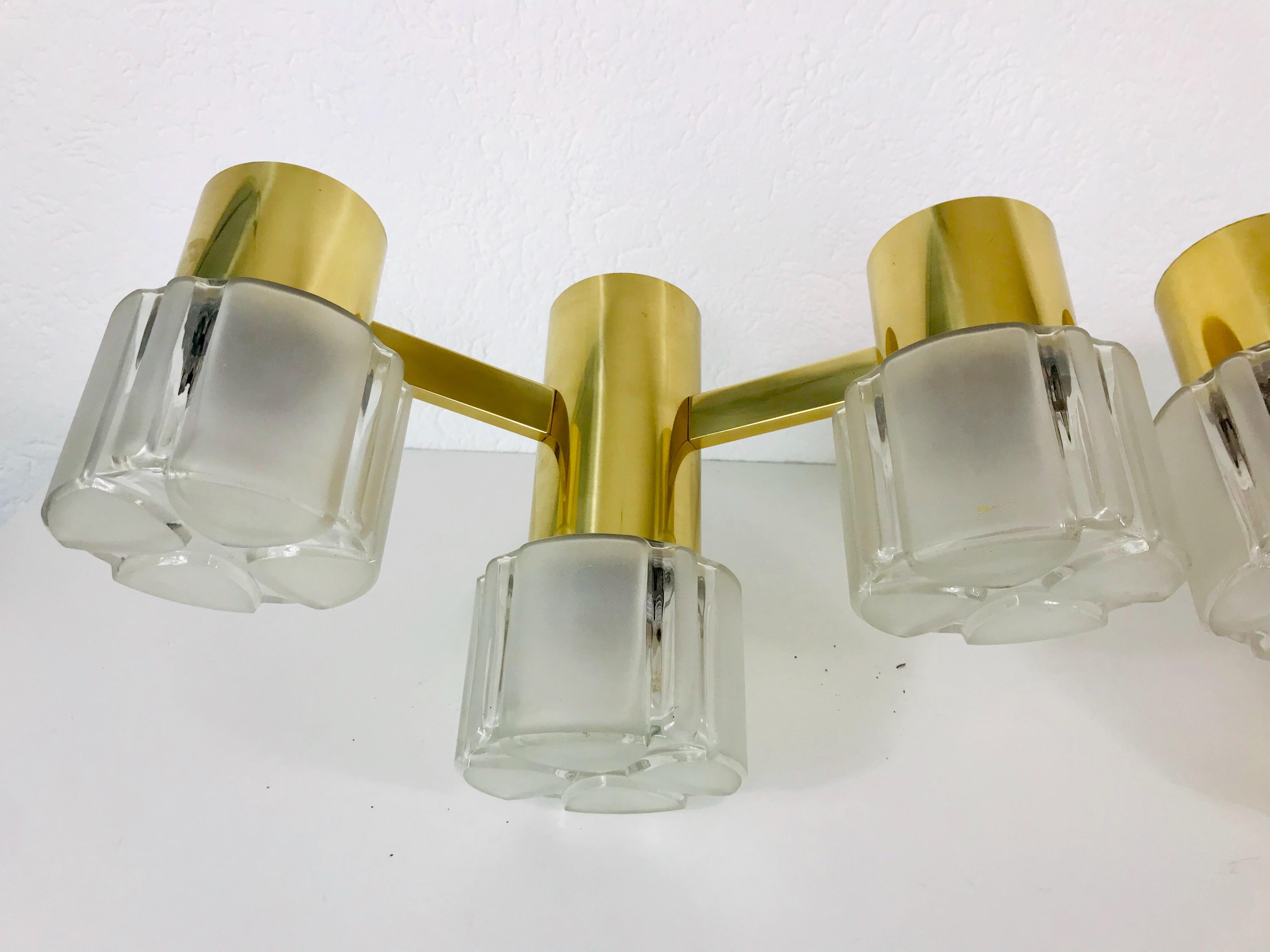 Midcentury pair of beautiful wall lights in the style of Hans Agne Jakobsson made in the 1960s. They have three glass elements. Polished brass body.

The light requires three E14 light bulbs. Very good vintage condition.

Free worldwide standard