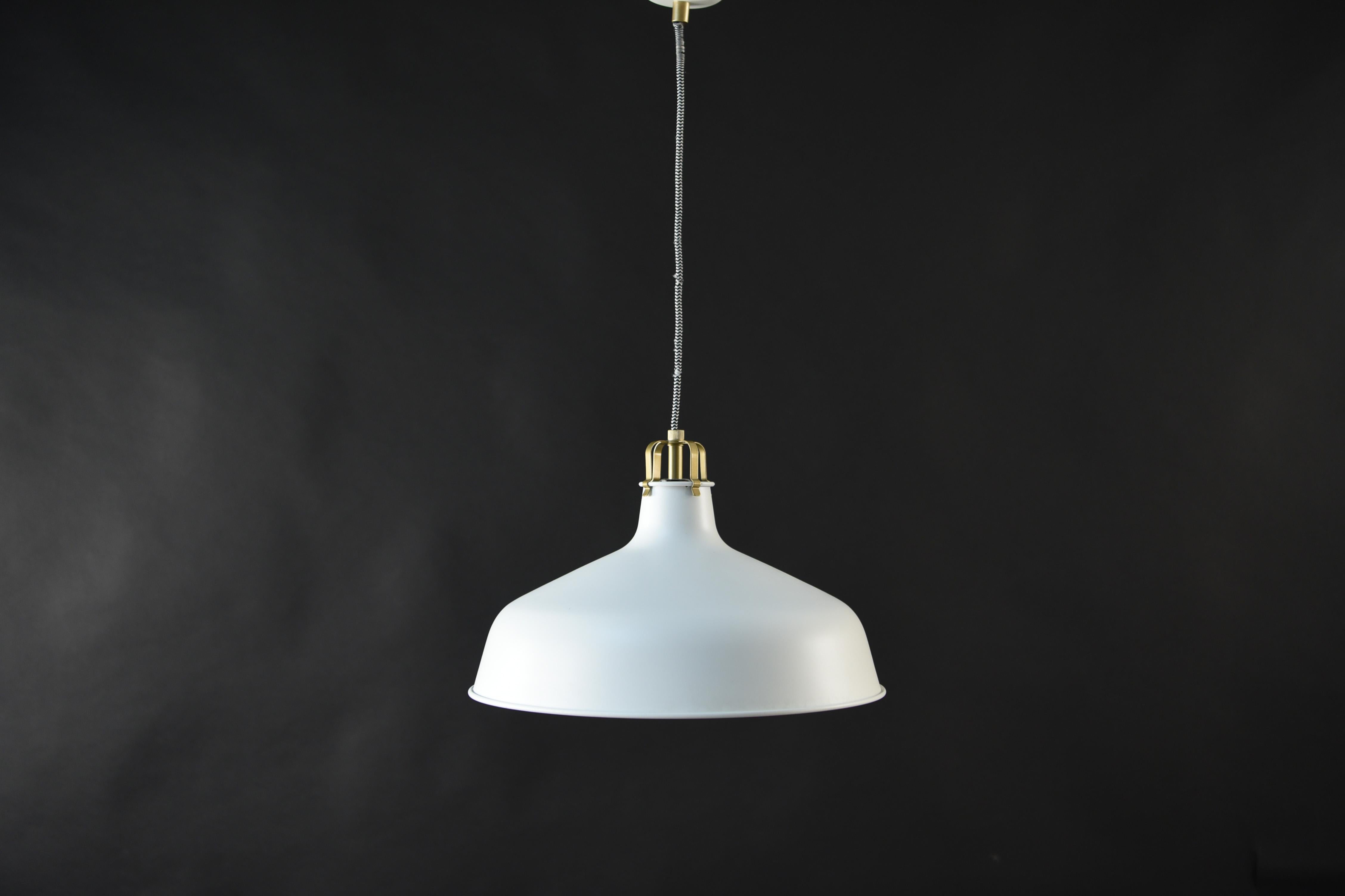 This Swedish midcentury pendant light is a simple, Classic form that can be used in virtually any interior. The white surface allows the light to be reflected outwards.