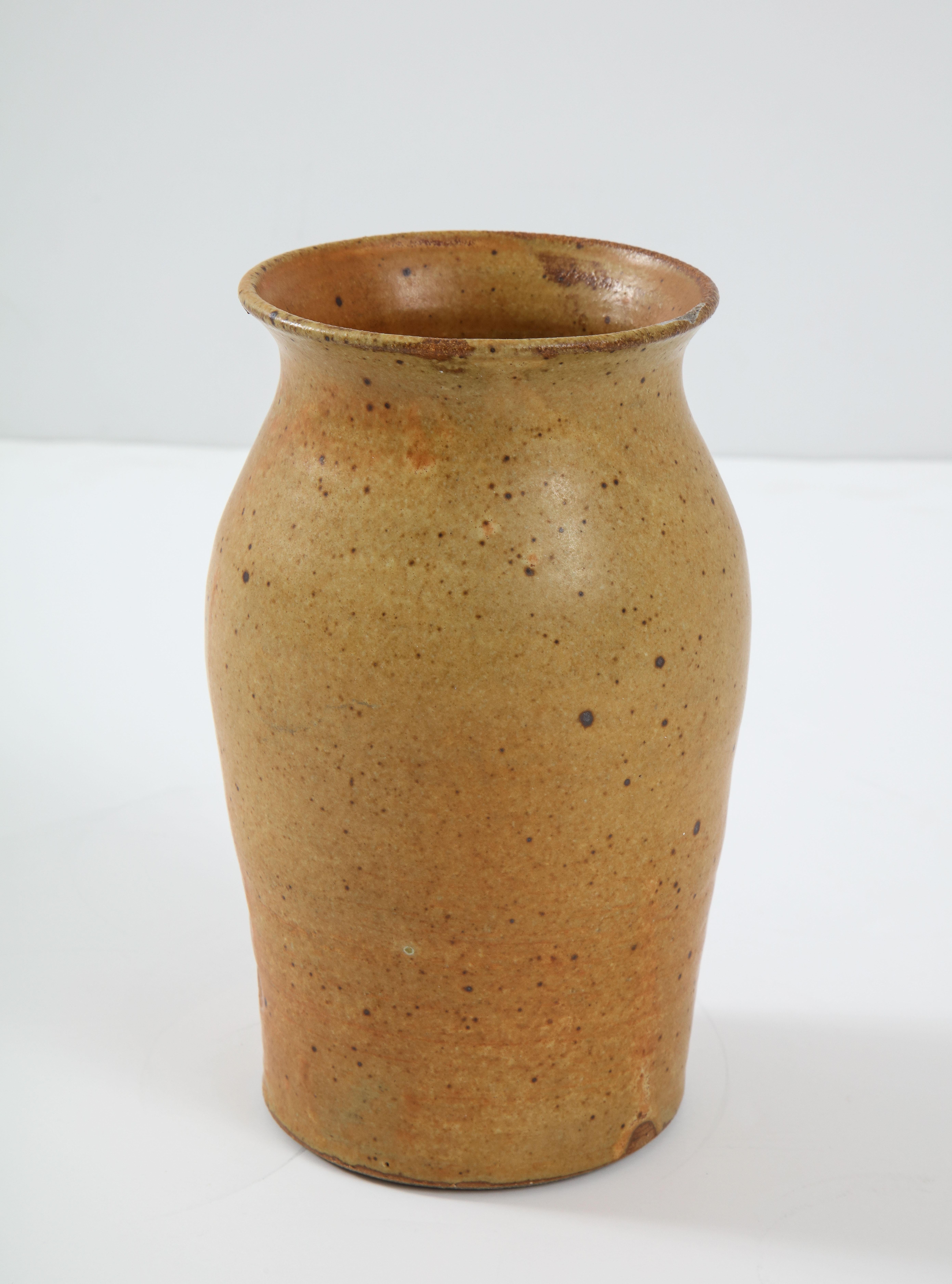 Swedish Ocher Tawny Speckled vase, signed, circa 1950. Two circular marks in the side of the vase indecipherable.