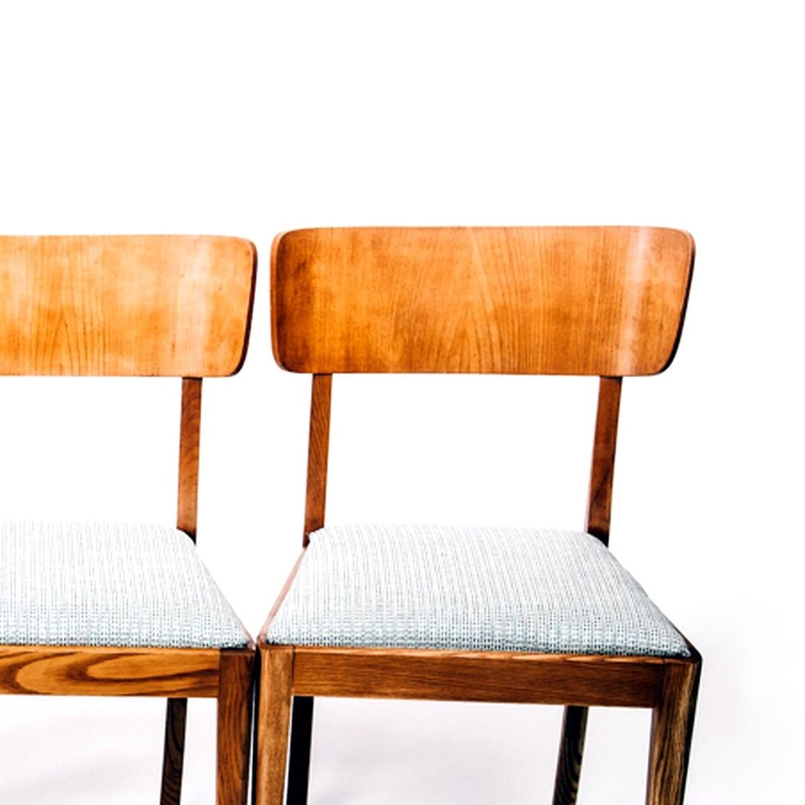 Time typical retro bevelled back seat chairs in teak. Fabric can easily be changed according to preference.