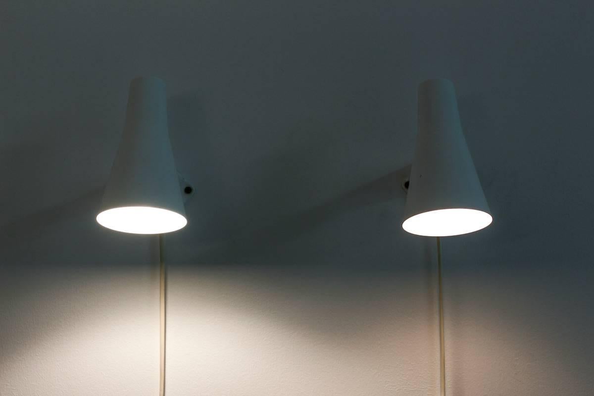 Swedish Mid-Century Modern wall lights or bed lights in white metal by Swedish manufacturer ASEA. 
Minimalistic and great quality, perfect for use as night lights.
Condition: Very good condition with some scratches on the original paint.
 