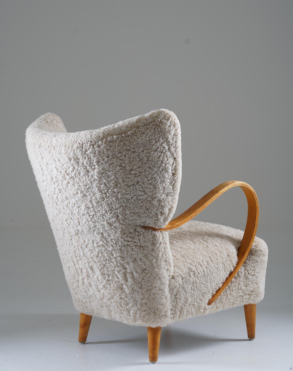 20th Century Swedish Midcentury Wingback Lounge Chair in Sheepskin For Sale