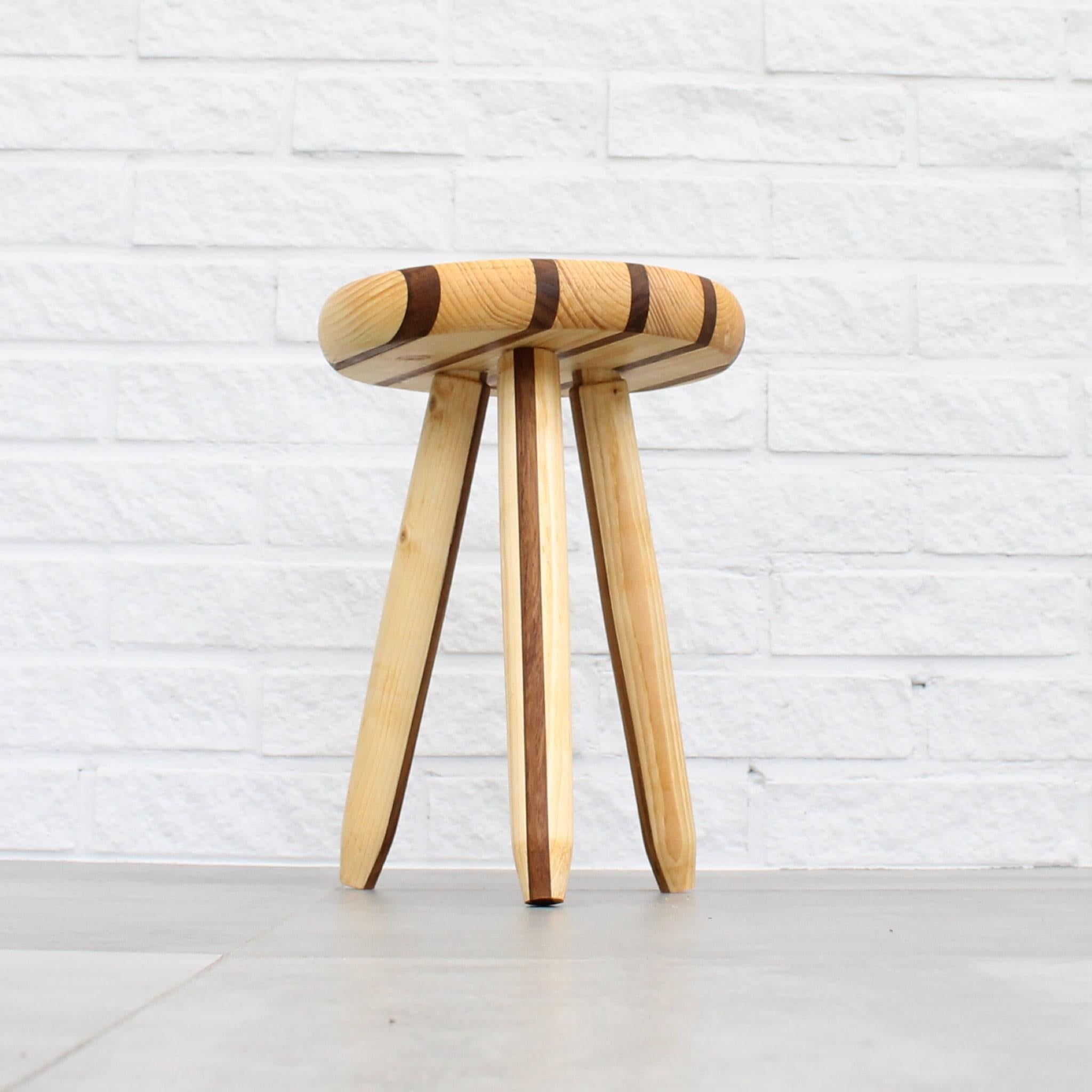 Swedish milking stool crafted from pine, seat with solid teak stripes. Handcrafted by Andreas Zätterqvist in Sweden using traditional techniques and mainly local materials. This very piece was exhibited at the ‘Gjort är gjort” exhibition in