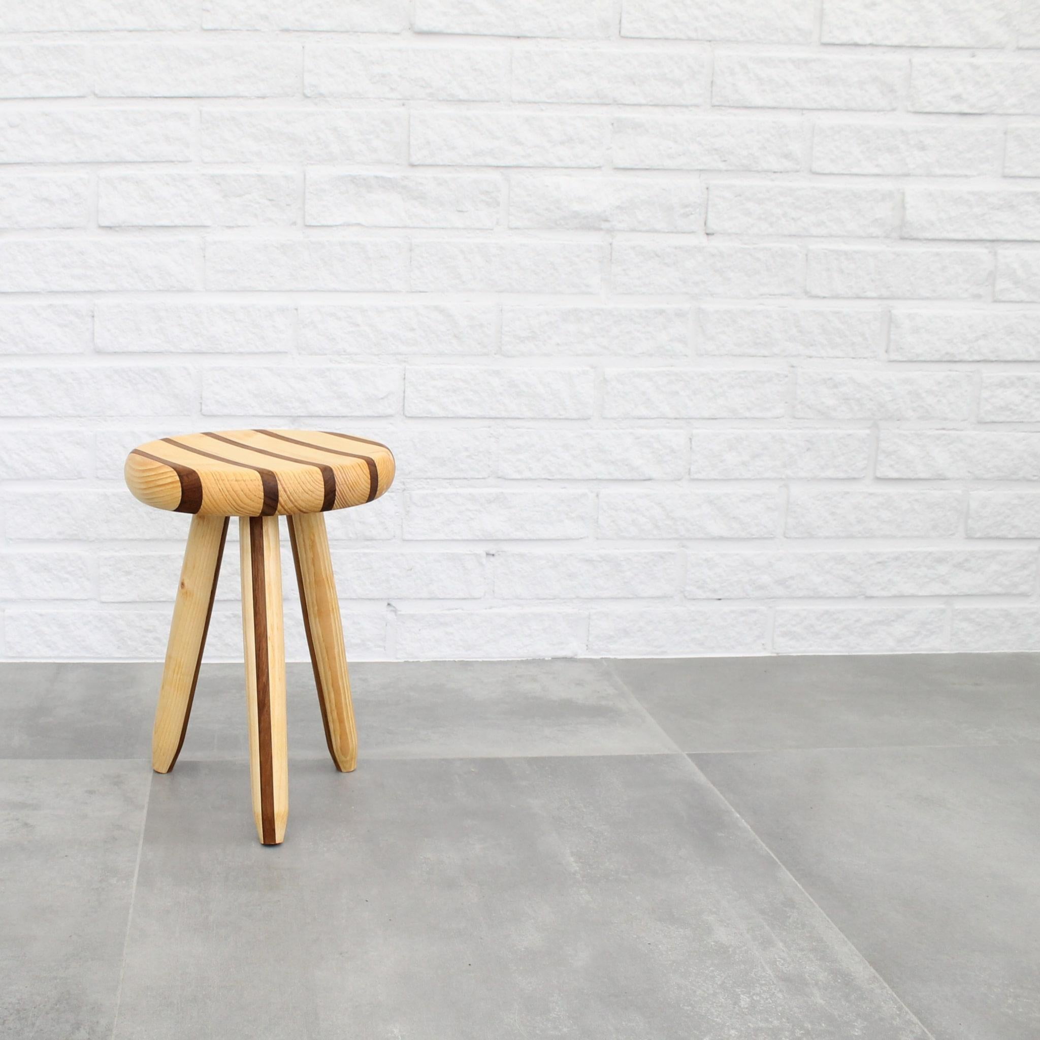 Turned Swedish milking stool in pine and teak by Andreas Zätterqvist