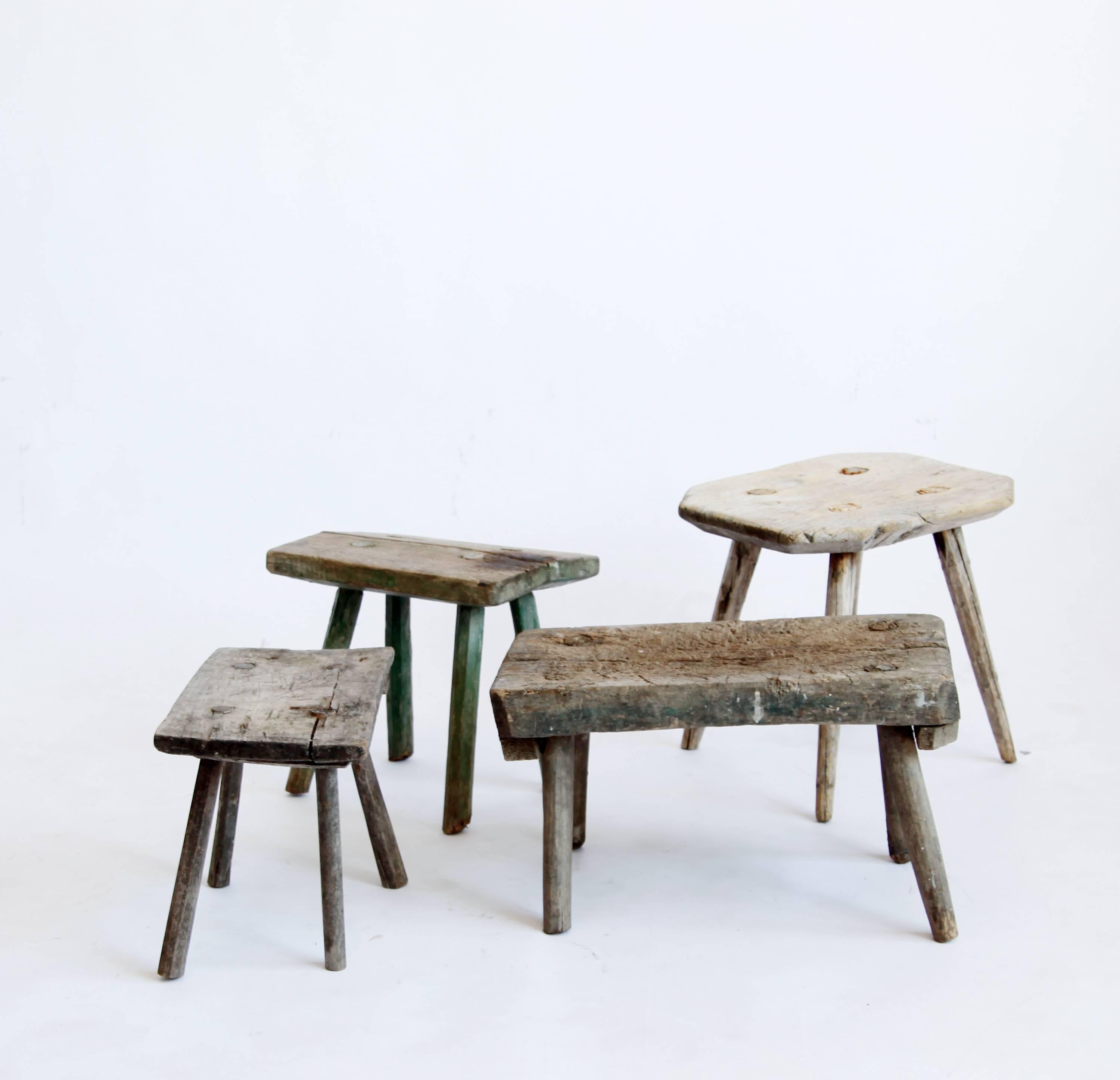 These low work stools will introduce a note of rough country elegance into any interior. They show the hands that made and used them. We love the variations in color and patina, and haven't done a thing to the surface, only stabilizing the legs.