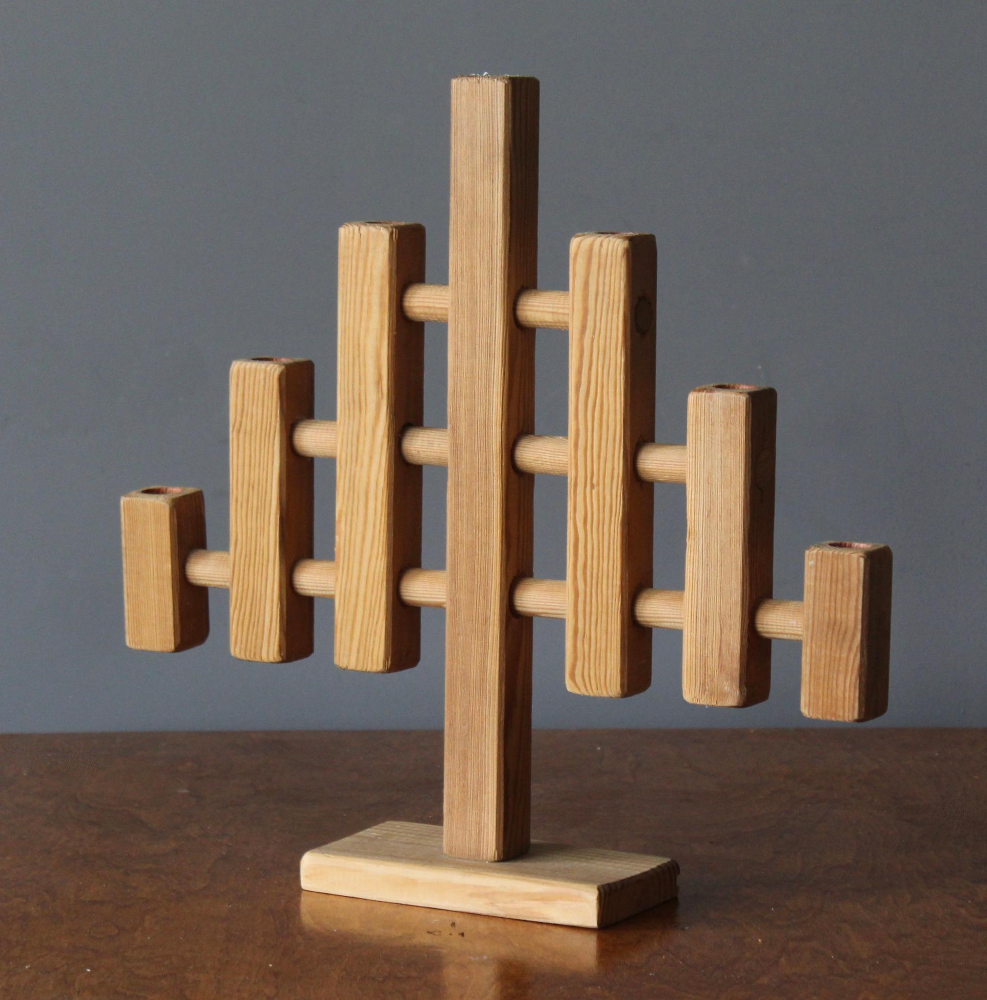 A sizable minimalist candelabra. Made in Sweden, c. 1970s.