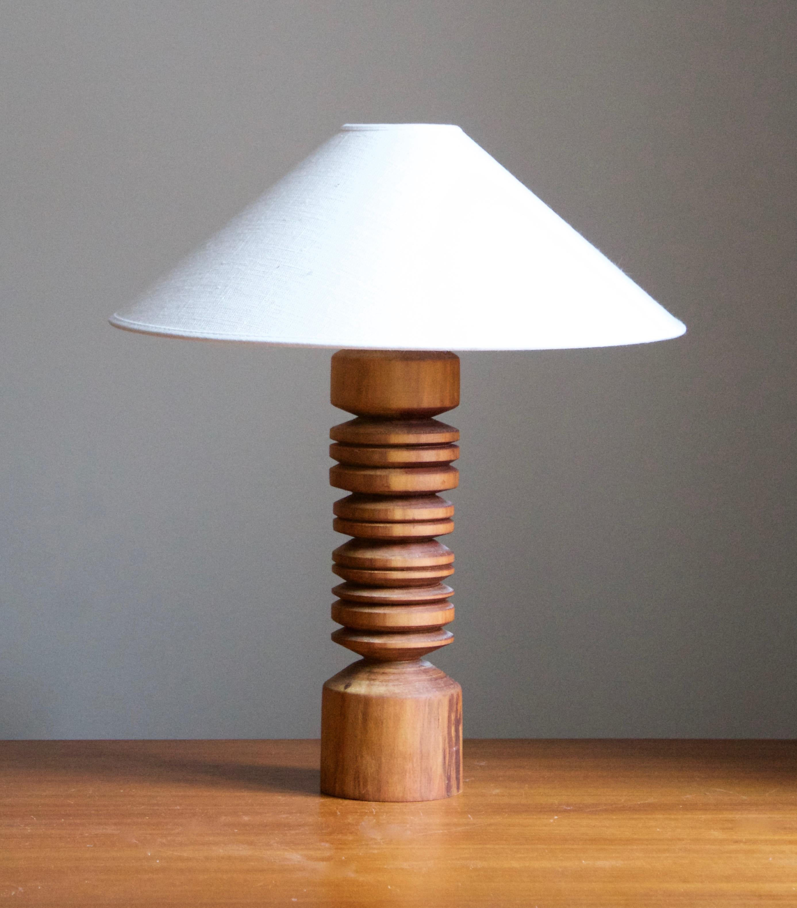 A solid wood table lamp, designed and produced in Sweden, c. 1970s. 

Stated dimensions exclude lampshade. Height includes socket. Sold without lampshade.